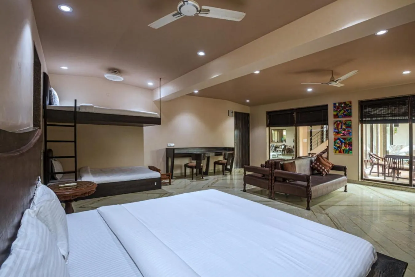 Bed in SaffronStays Aura - 4BR luxury pool villa with gym, BBQ deck, lawns & indoor games near Kihim Beach