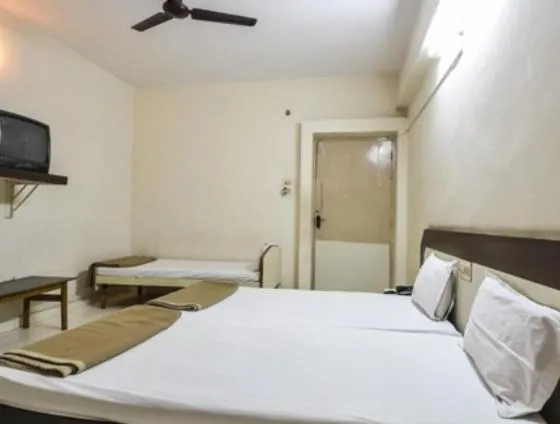 Bed in Hotel Maya Deluxe