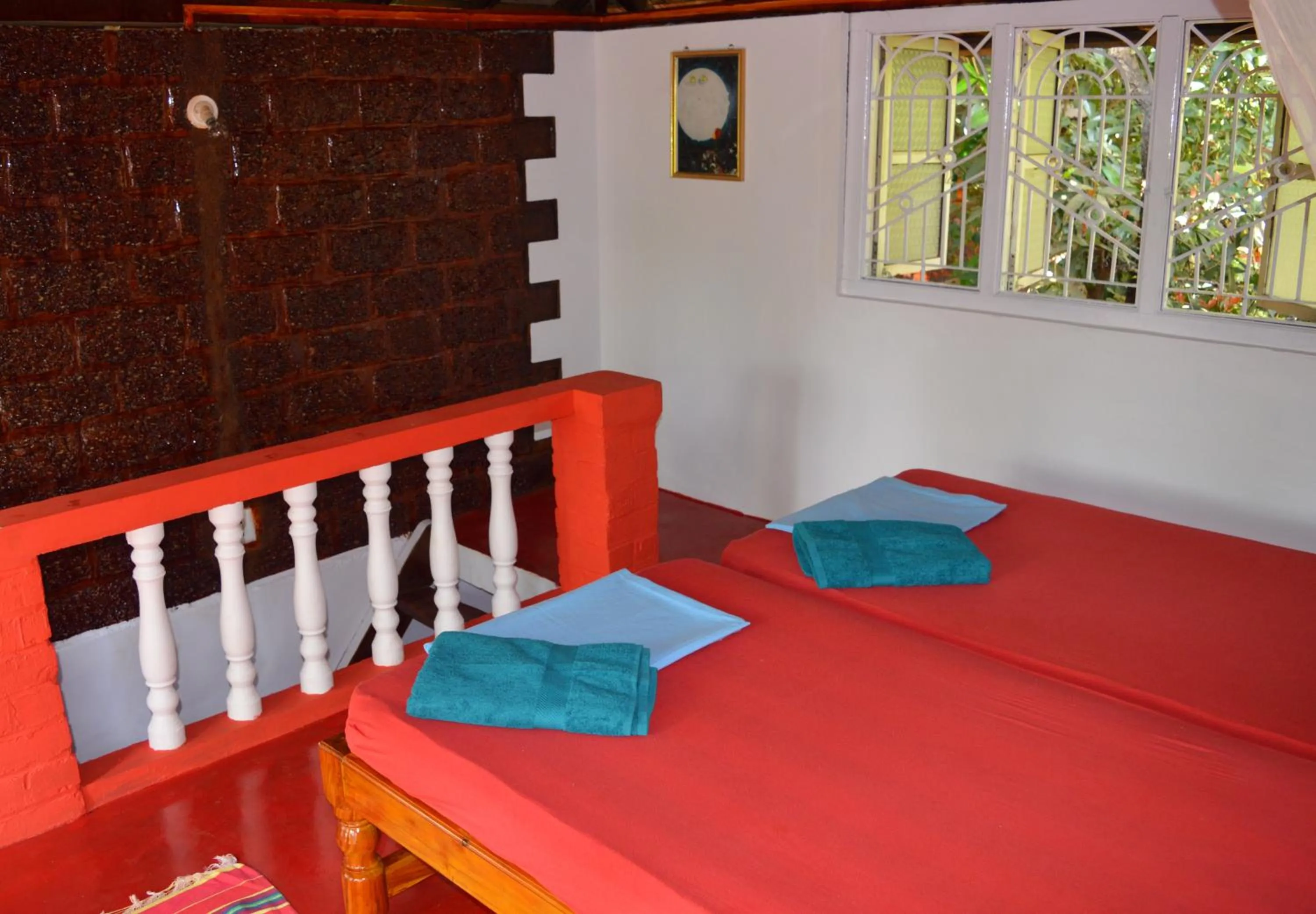 Photo of the whole room, Bed in Namaste Yoga Farm