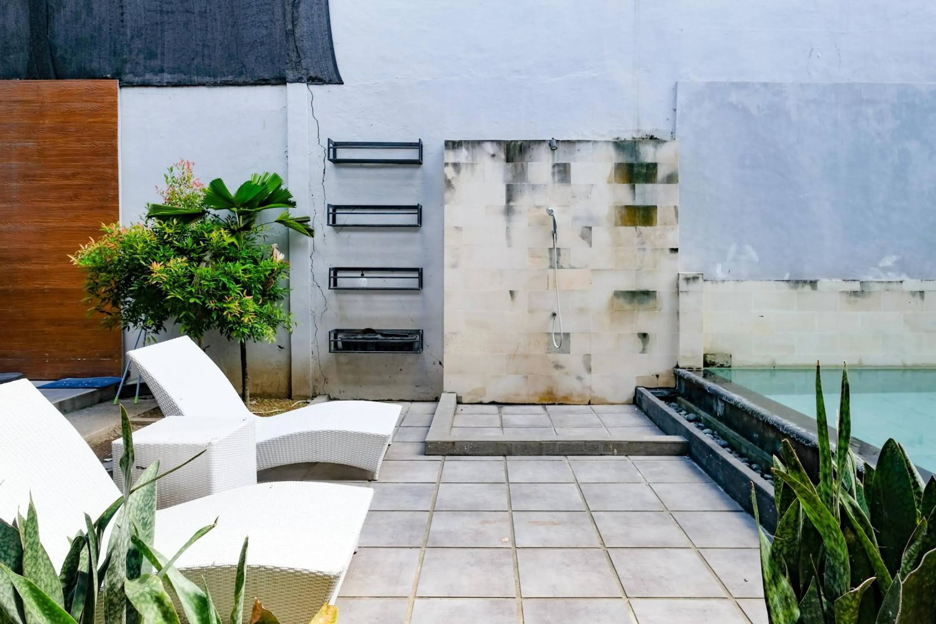 Seating area in Lega Legi Town House Seminyak by The Lavana