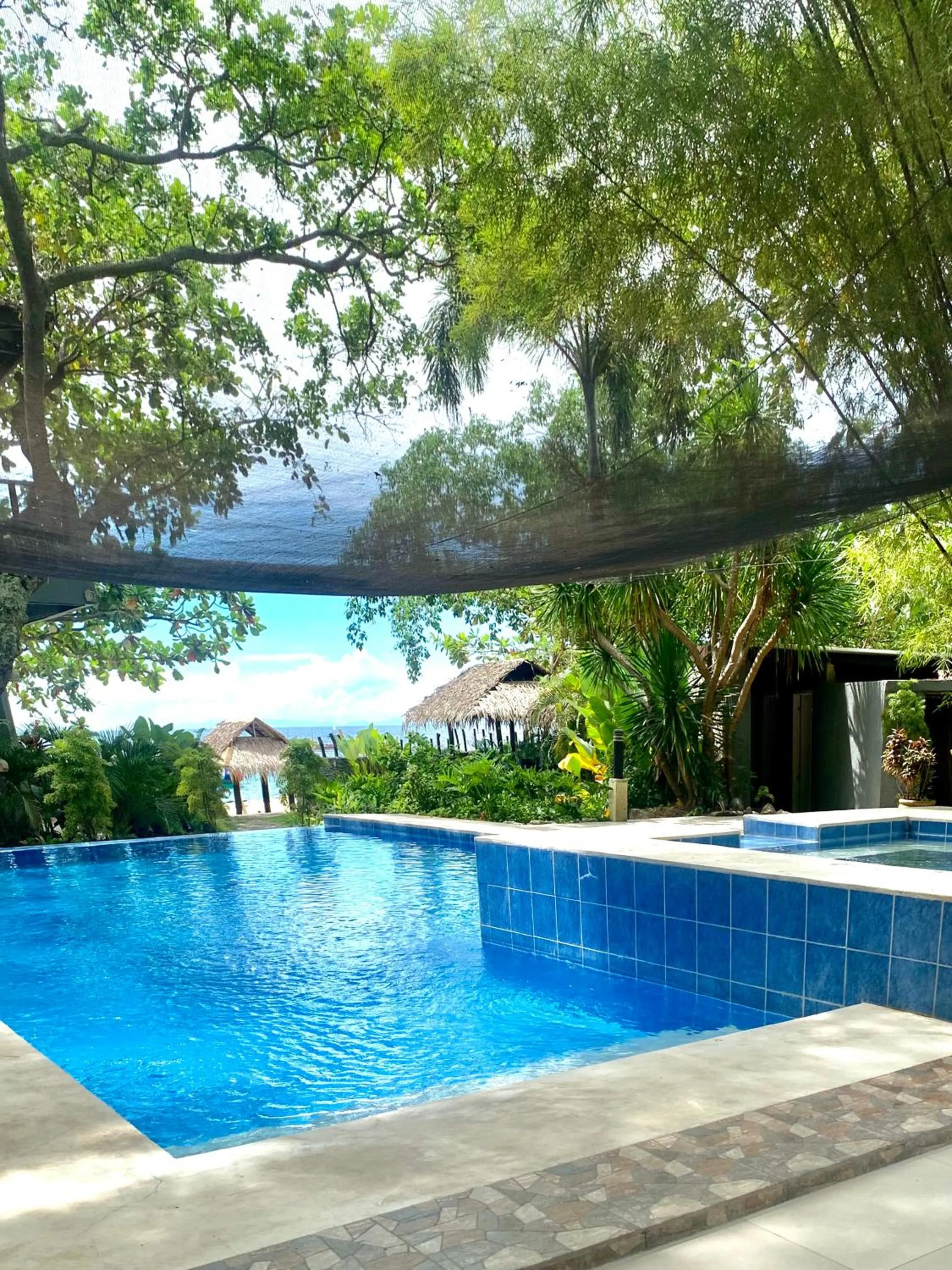 Swimming pool in The Henry Resort Taramindu Laiya