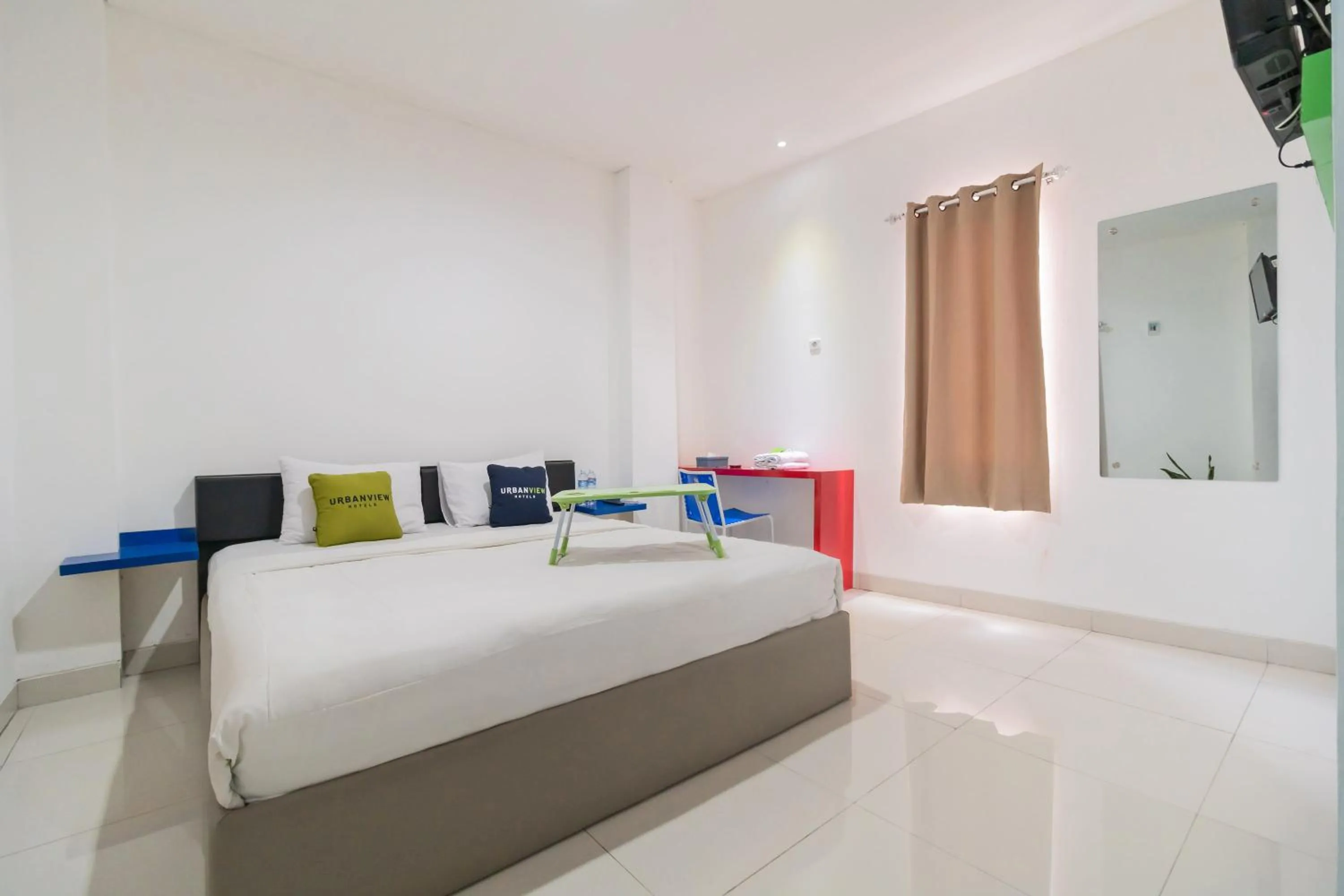 Photo of the whole room, Bed in Urbanview Hotel Ephe Palembang by RedDoorz