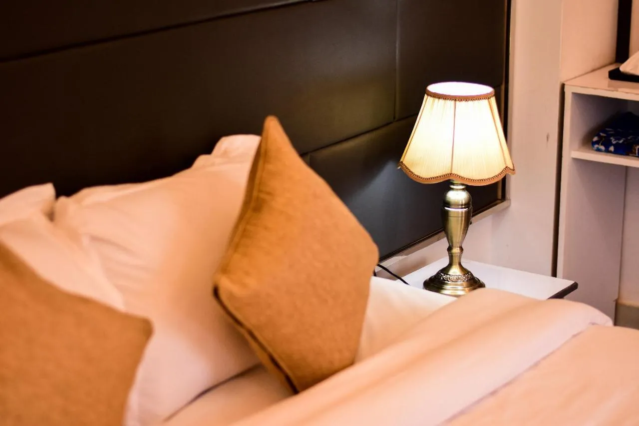 Bed in The Grand Mafi Hotel & Spa