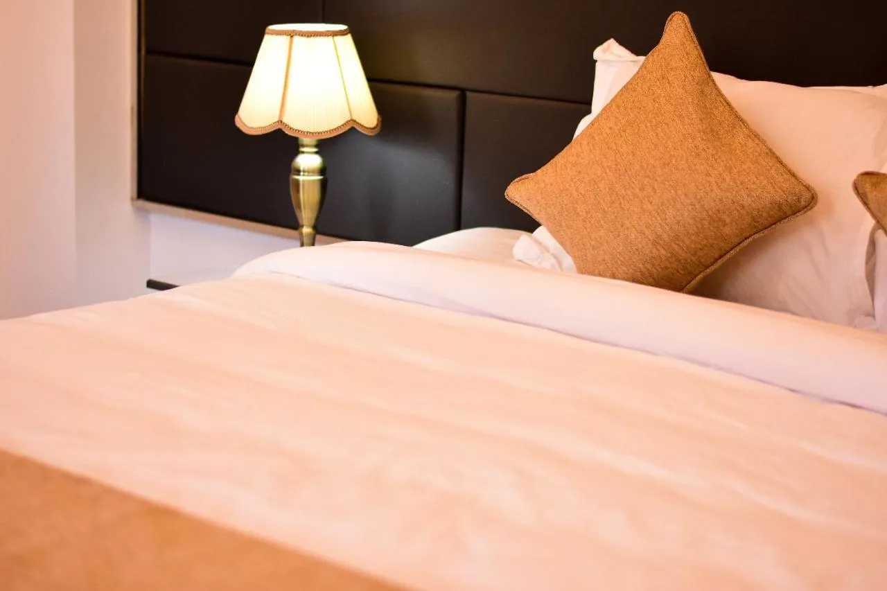 Bed in The Grand Mafi Hotel & Spa