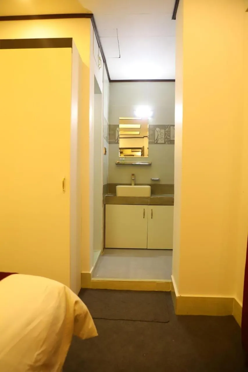 Bed in The Grand Mafi Hotel & Spa