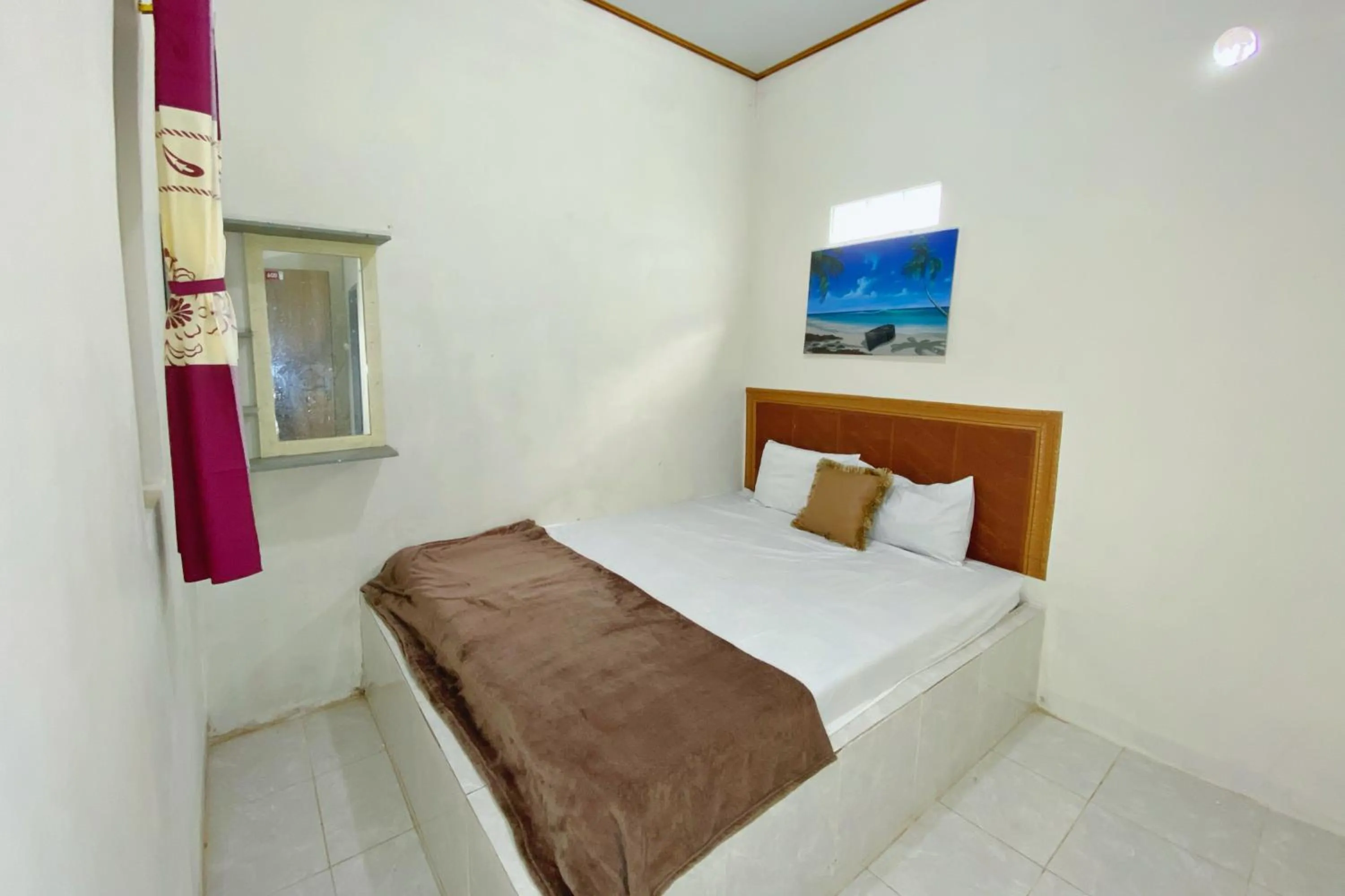 Bedroom, Bed in Central House Karimunjawa Mitra RedDoorz