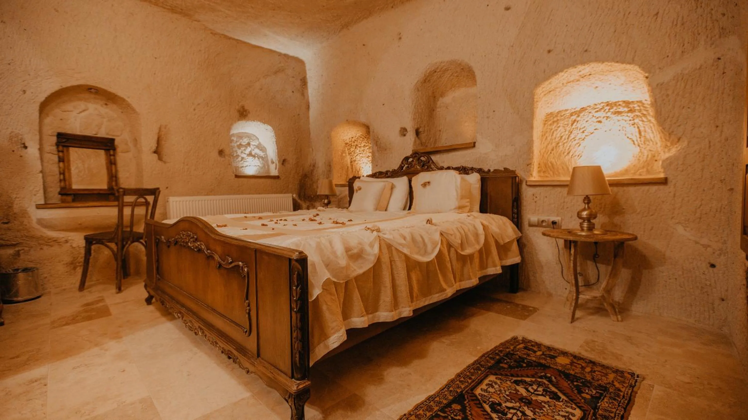 Bed in Serenus Cave Suites