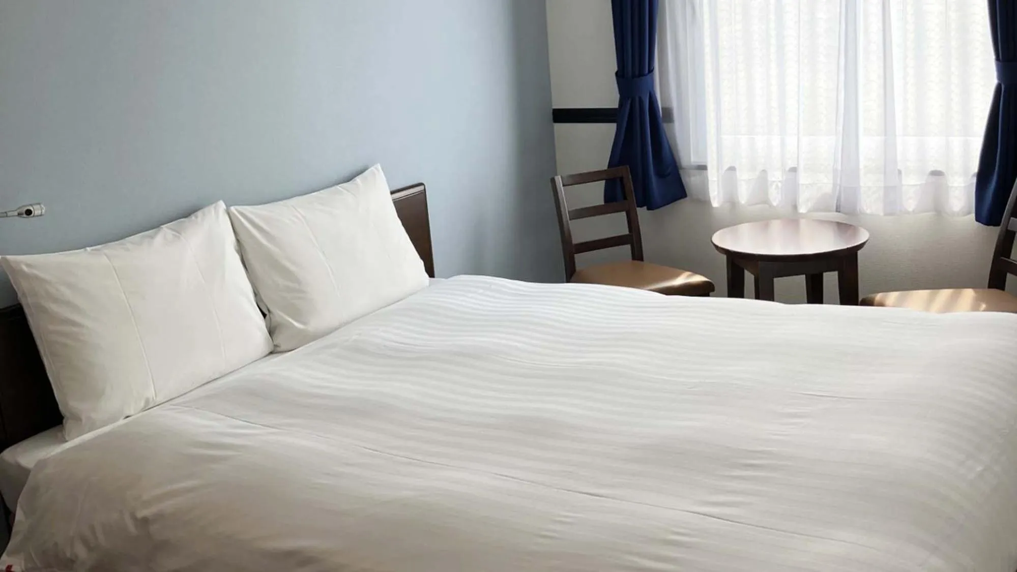 Bedroom, Bed in Toyoko Inn Shin takaoka eki Shinkansen Minami guchi