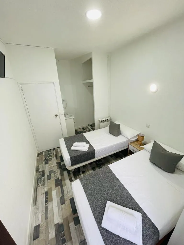 Bed in HOSTAL Noche y Dia