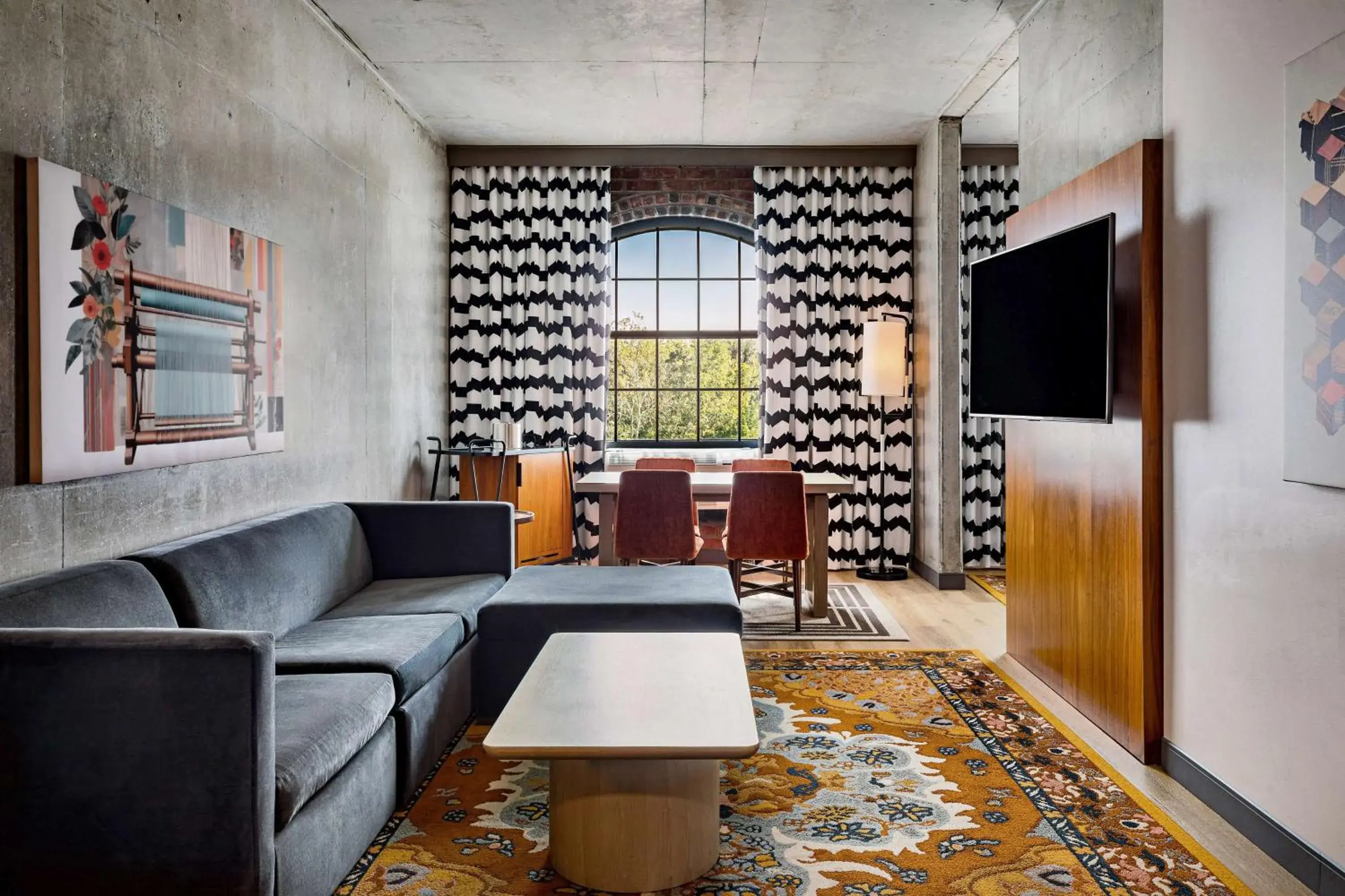 Living room in The LOOM Hotel, Tapestry Collection by Hilton Living room in The LOOM Hotel, Tapestry Collection by Hilton