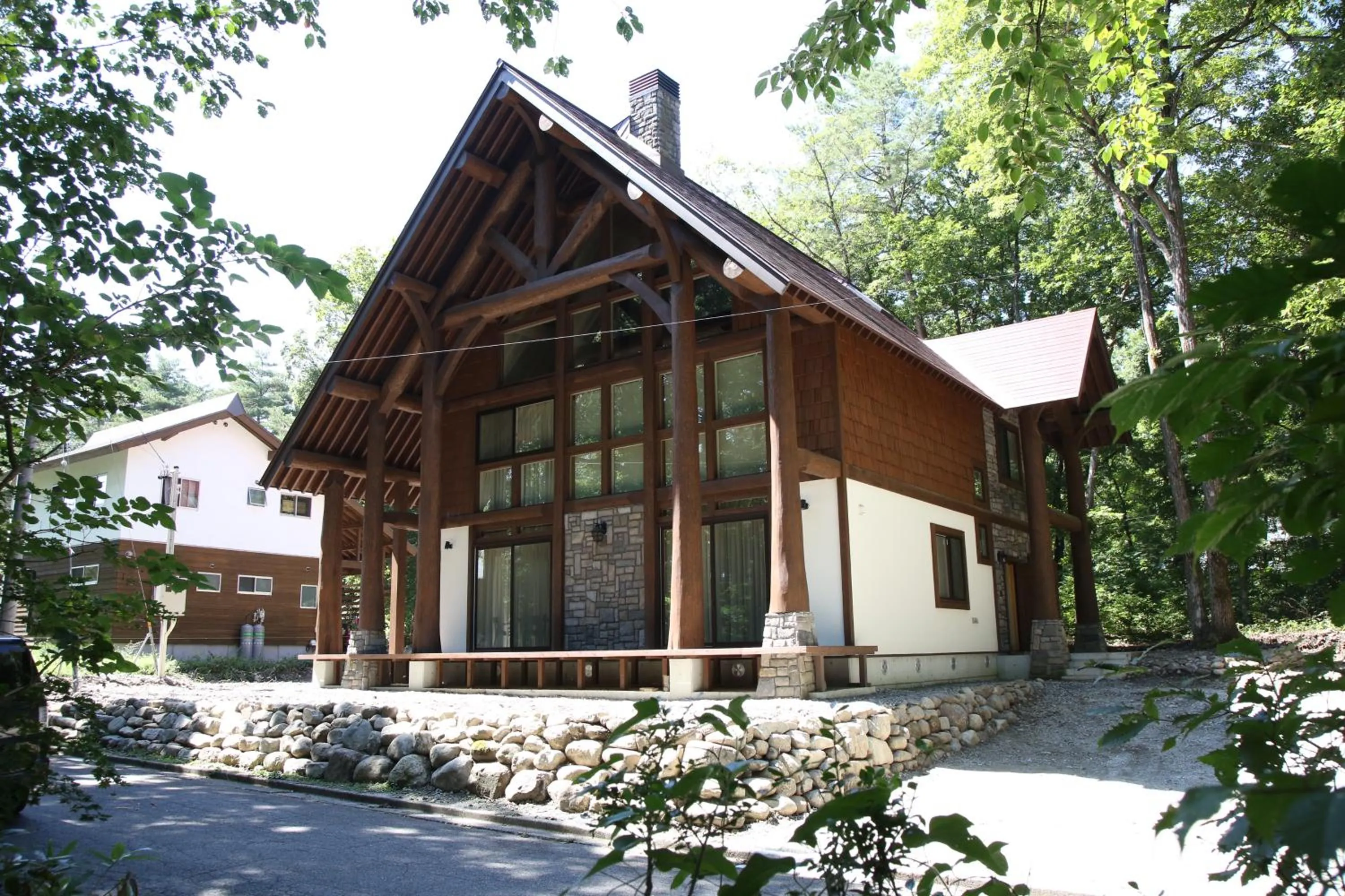 Facade/entrance in Villa Bavaria by Hakuba White Fox Company