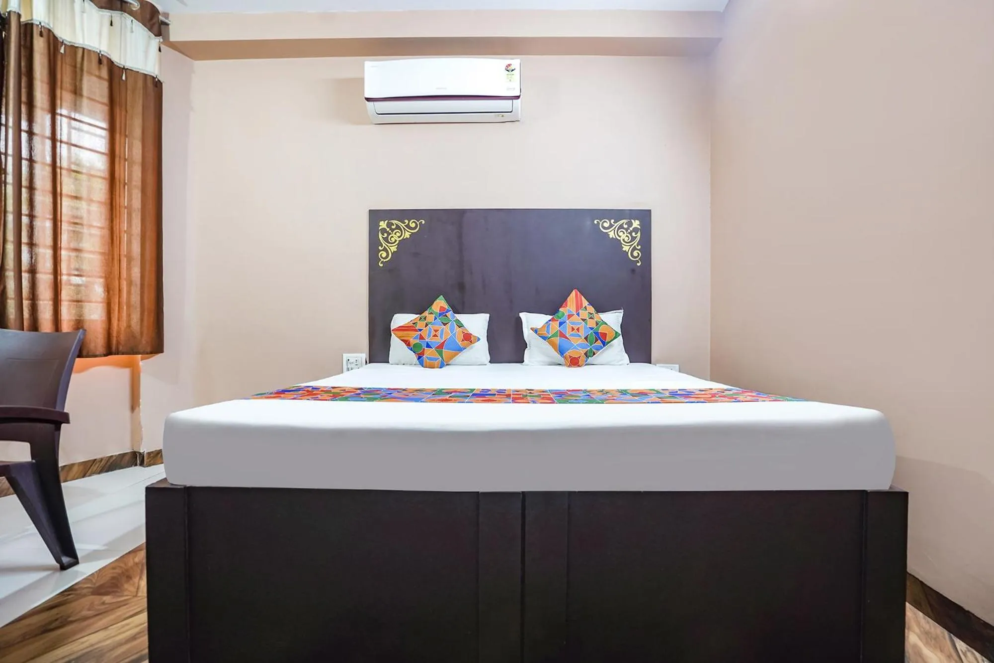 Bed in FabHotel Krishna Heights