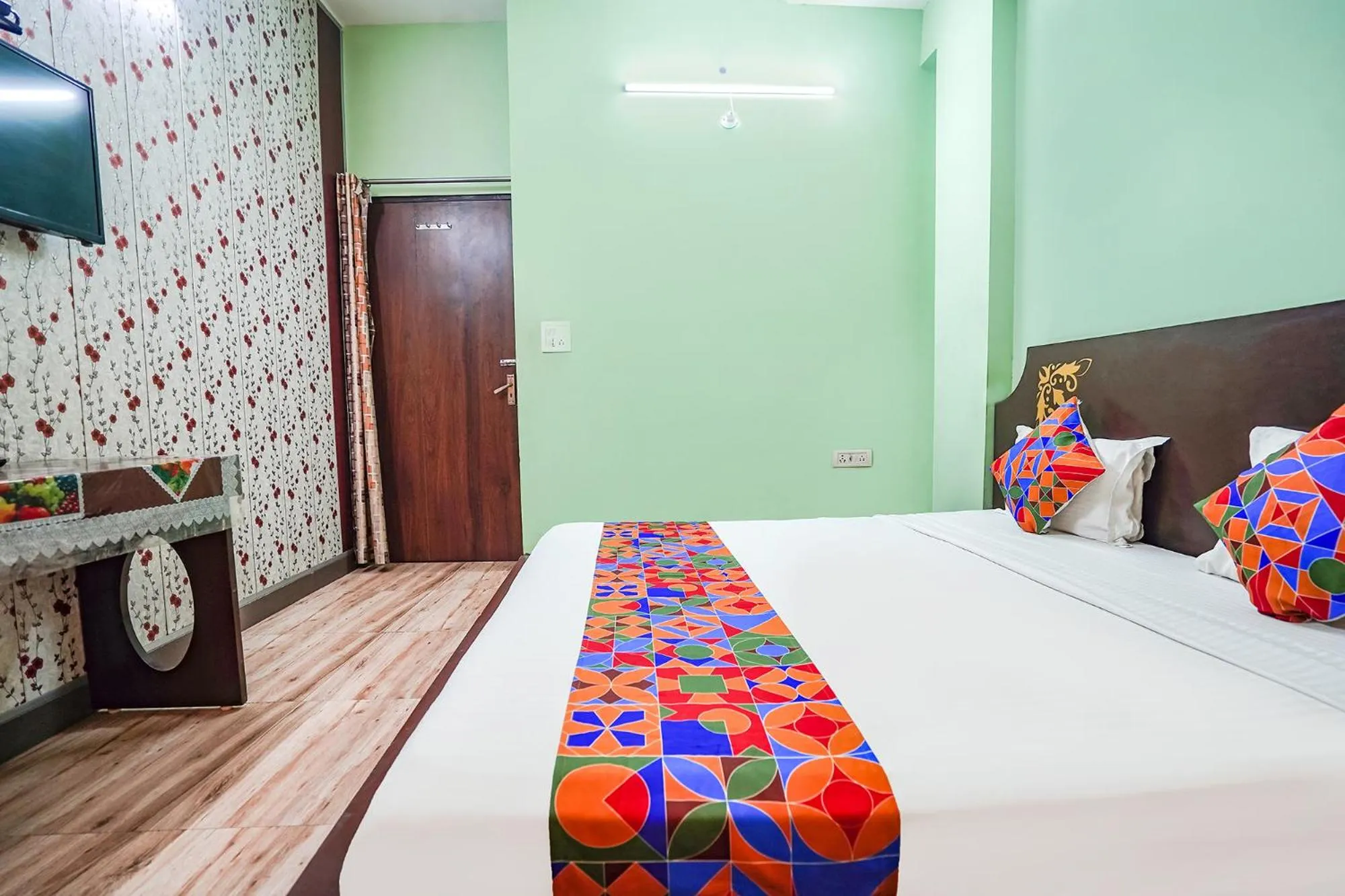 Bed in FabHotel Krishna Heights