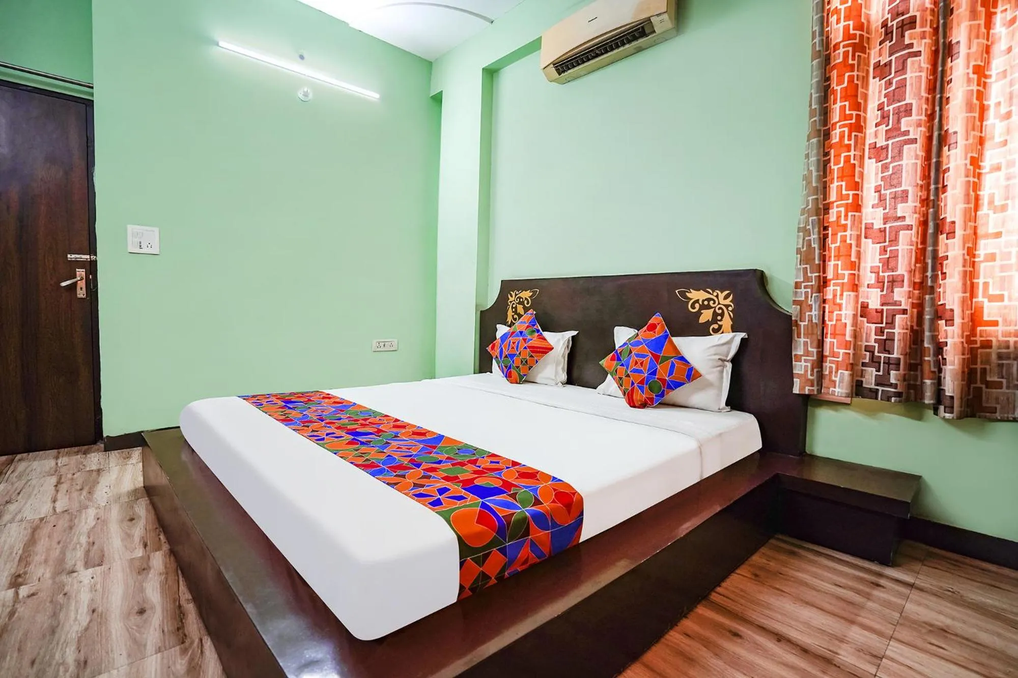 Bed in FabHotel Krishna Heights