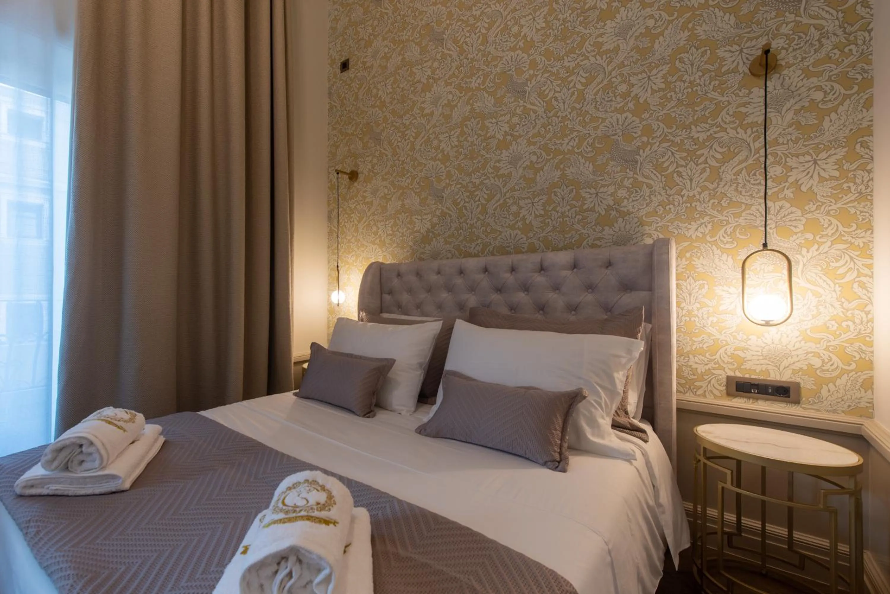 Bed in Capolavoro Suites