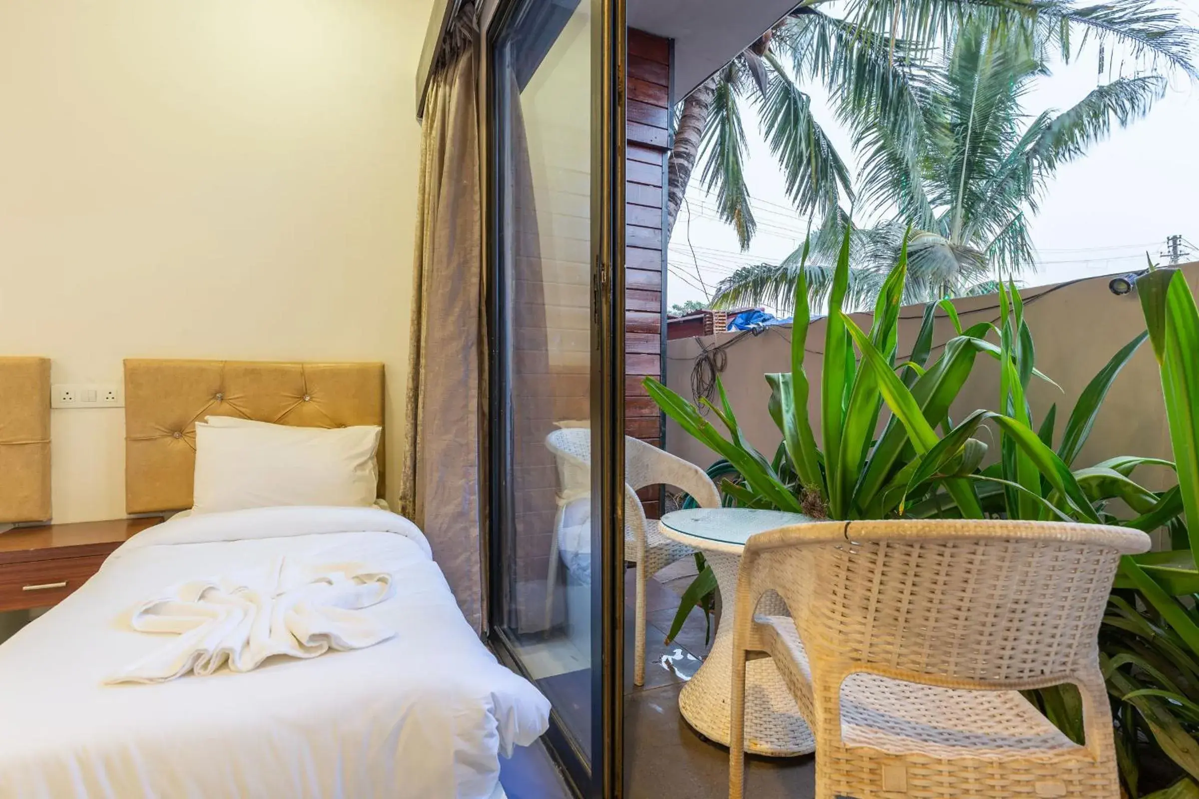 Balcony/Terrace, Bed in Amara Oceanfront Resort & Club Baga Balcony/Terrace, Bed in Amara Oceanfront Resort & Club Baga