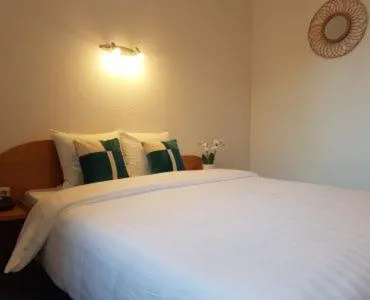 Bed in Hôtel La Charbonnade