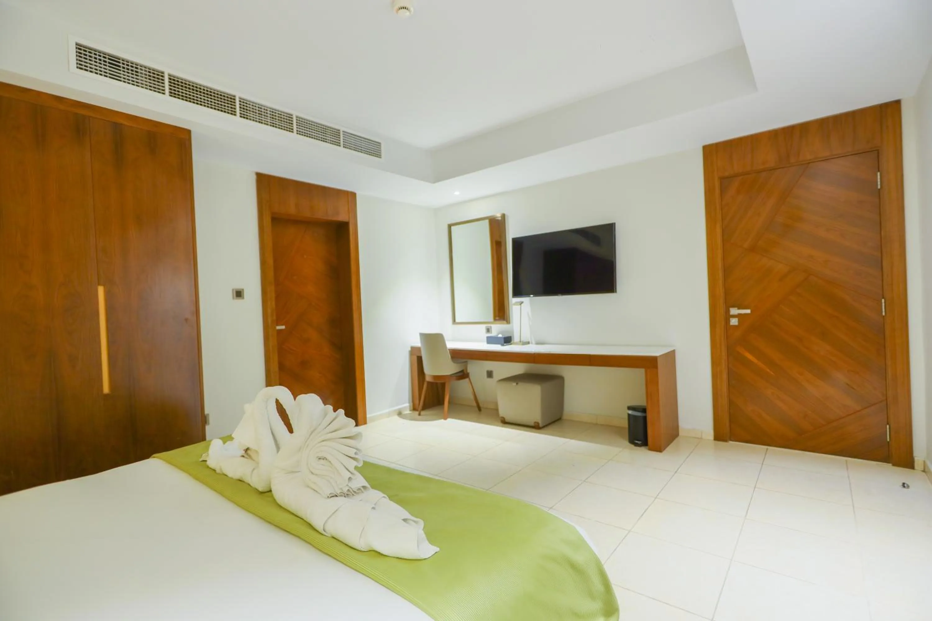 Bed in Ramee Palace Hotel