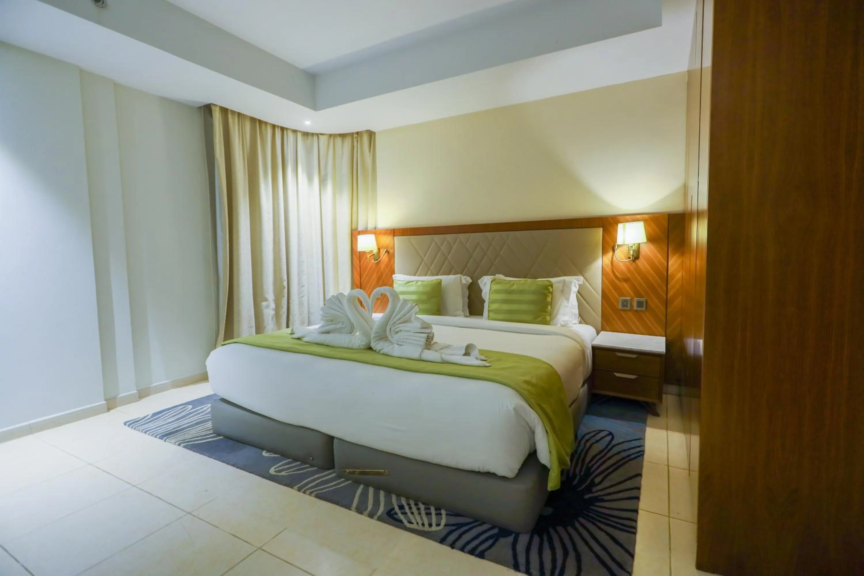 Bed in Ramee Palace Hotel