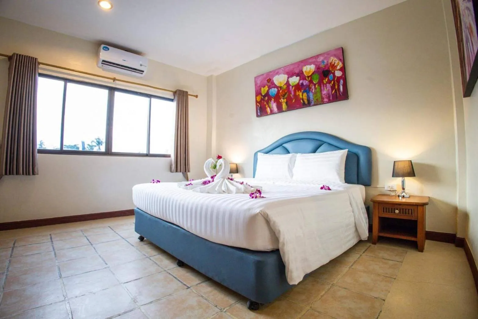 Bed in Rico's Patong Hotel