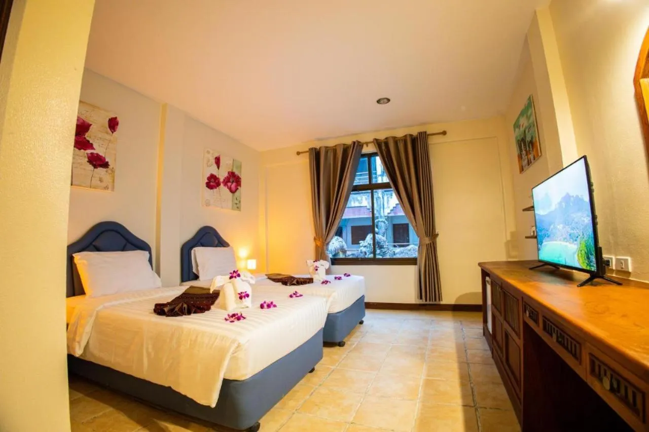 Bed in Rico's Patong Hotel