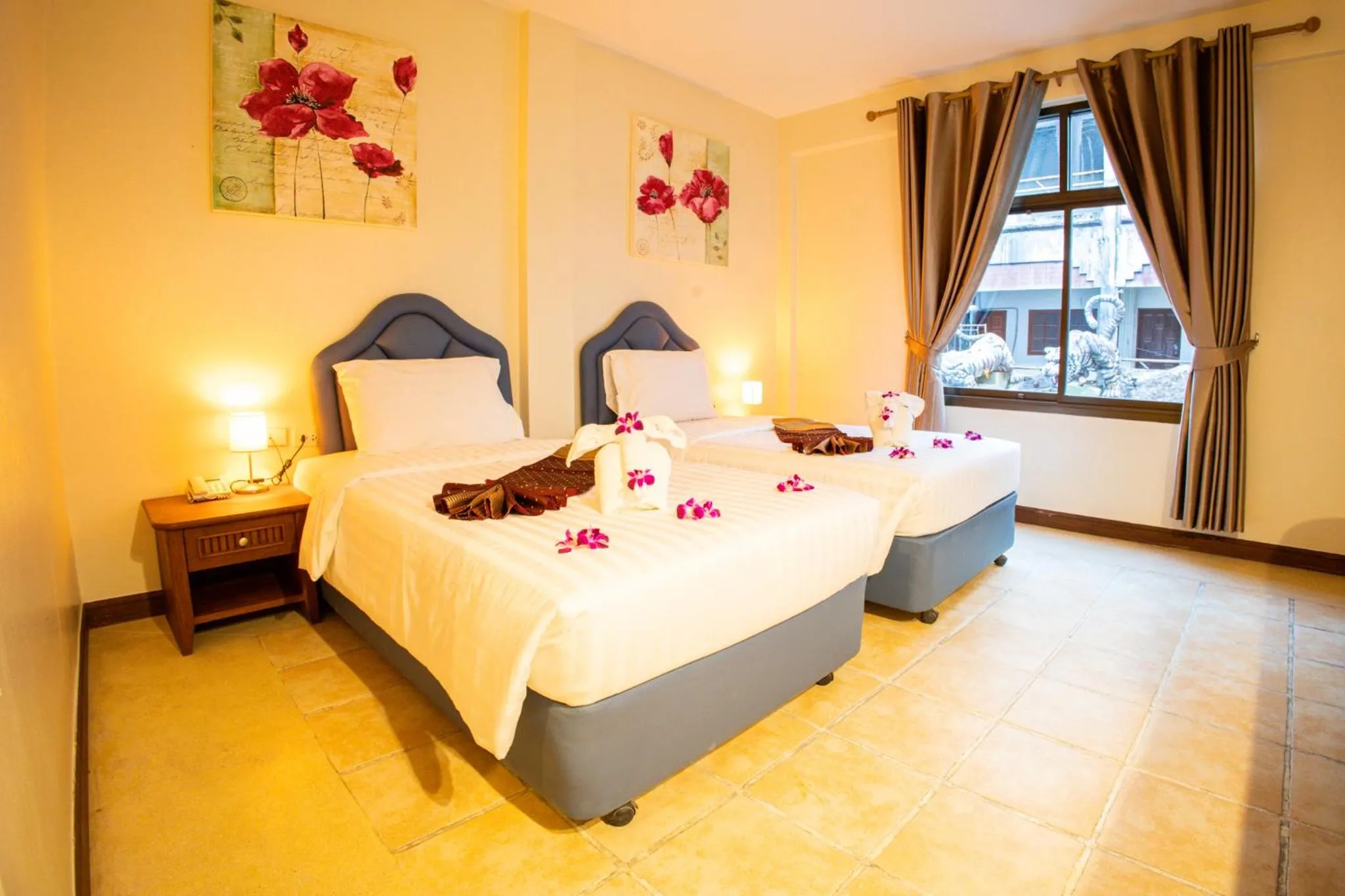 Bed in Rico's Patong Hotel