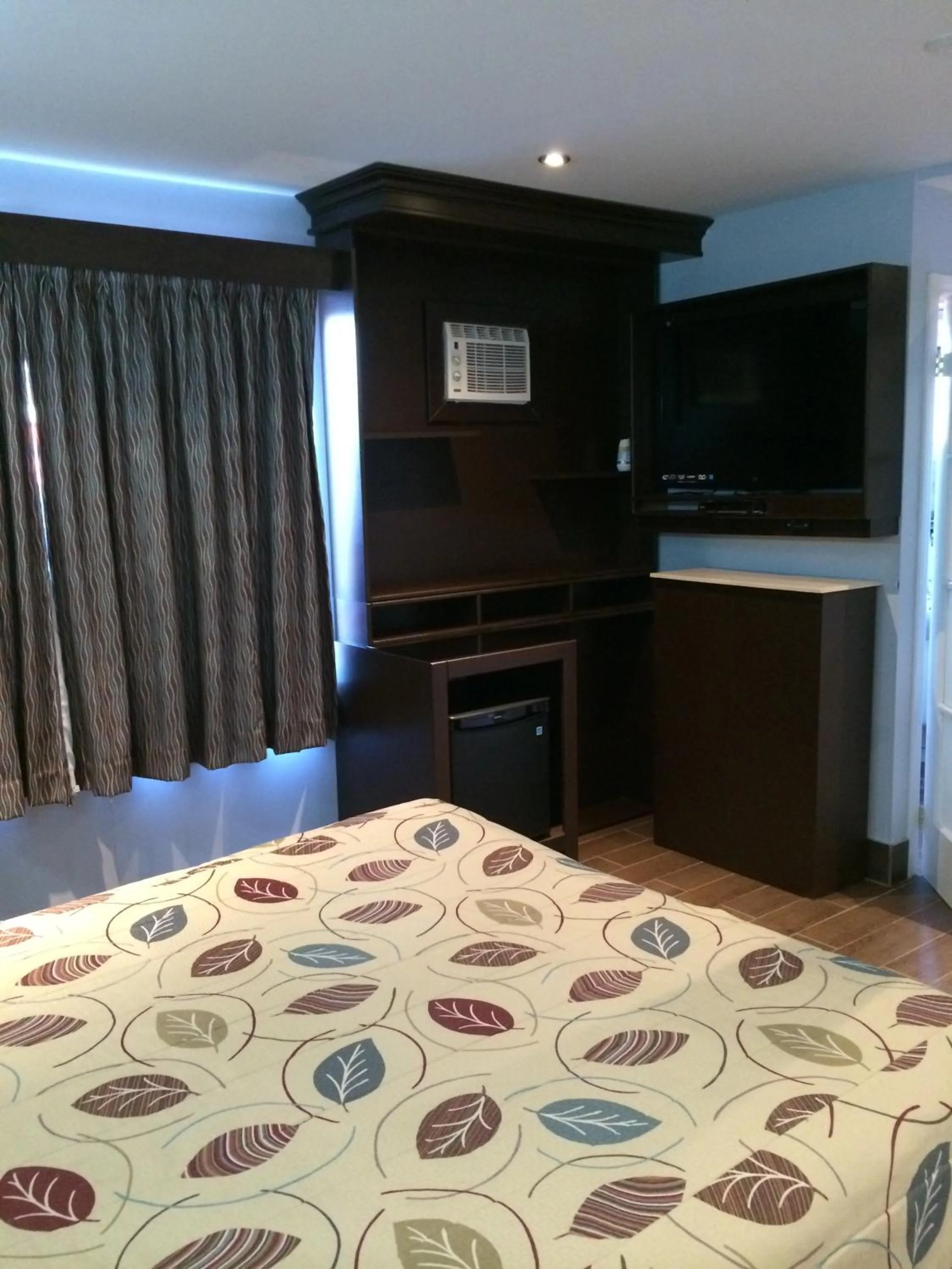 Bed in Olux Hotel-Motel-Suites