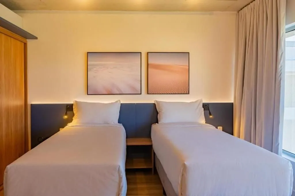 Bed in Atrium Studios by Xtay - Conforto em Palhoça, a poucos metros da praia