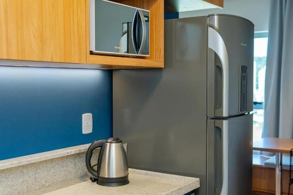 Kitchen or kitchenette in Atrium Studios by Xtay - Conforto em Palhoça, a poucos metros da praia