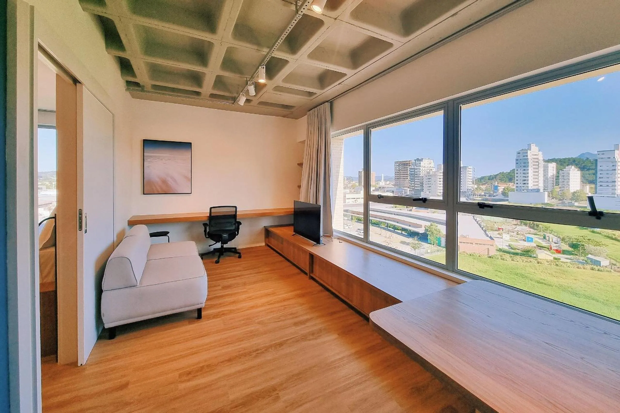 Bedroom in Atrium Studios by Xtay - Conforto em Palhoça, a poucos metros da praia