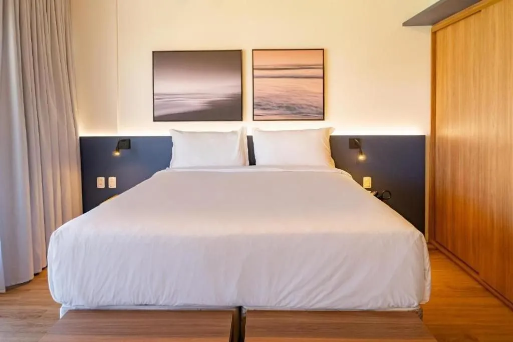 Bed in Atrium Studios by Xtay - Conforto em Palhoça, a poucos metros da praia