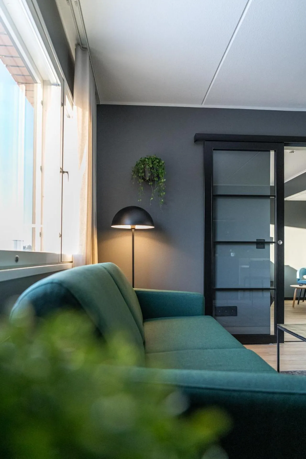 Living room in Hotelli Sointu by UHANDA