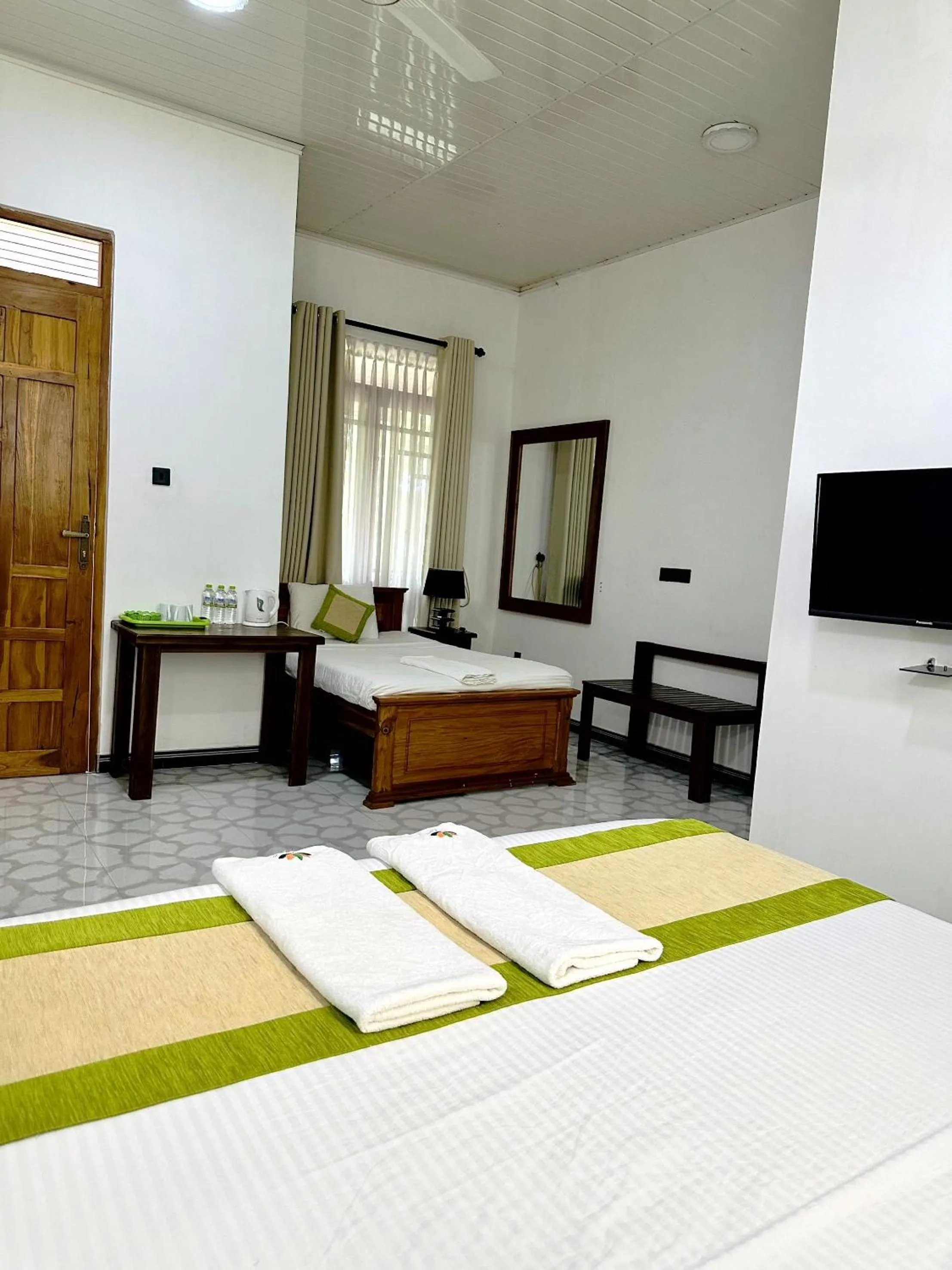 Bed in L S Lanka Hotel Dambulla