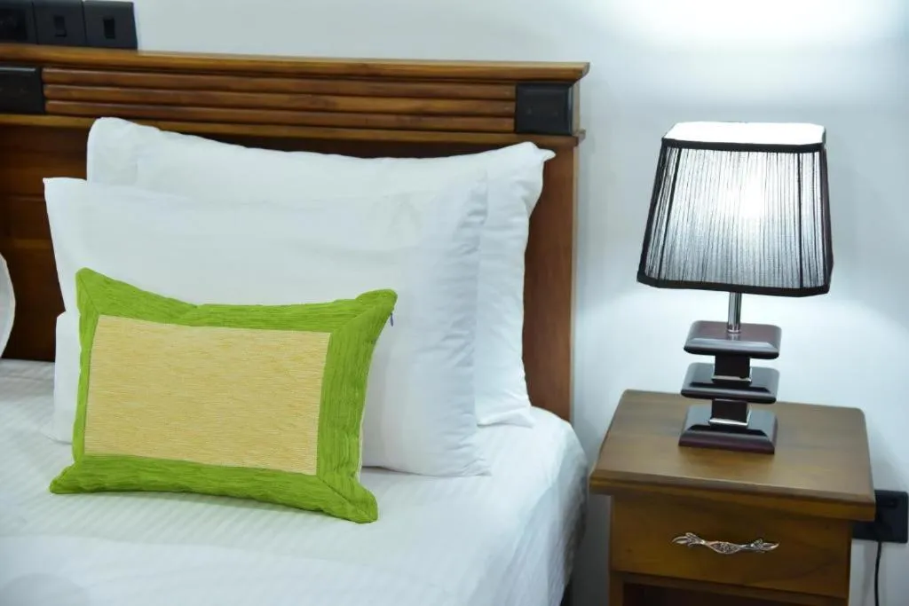 Bed in L S Lanka Hotel Dambulla