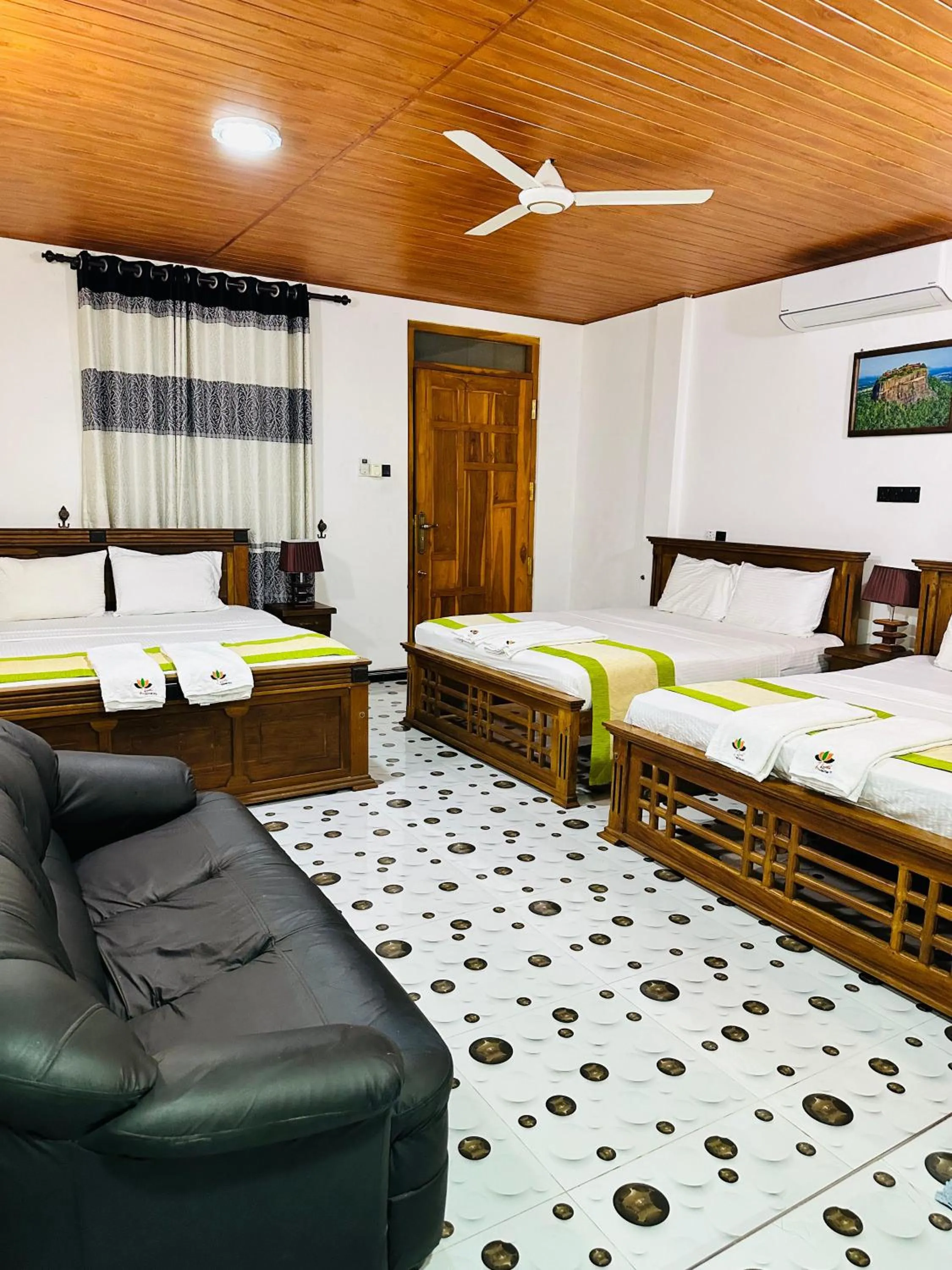 Bed in L S Lanka Hotel Dambulla