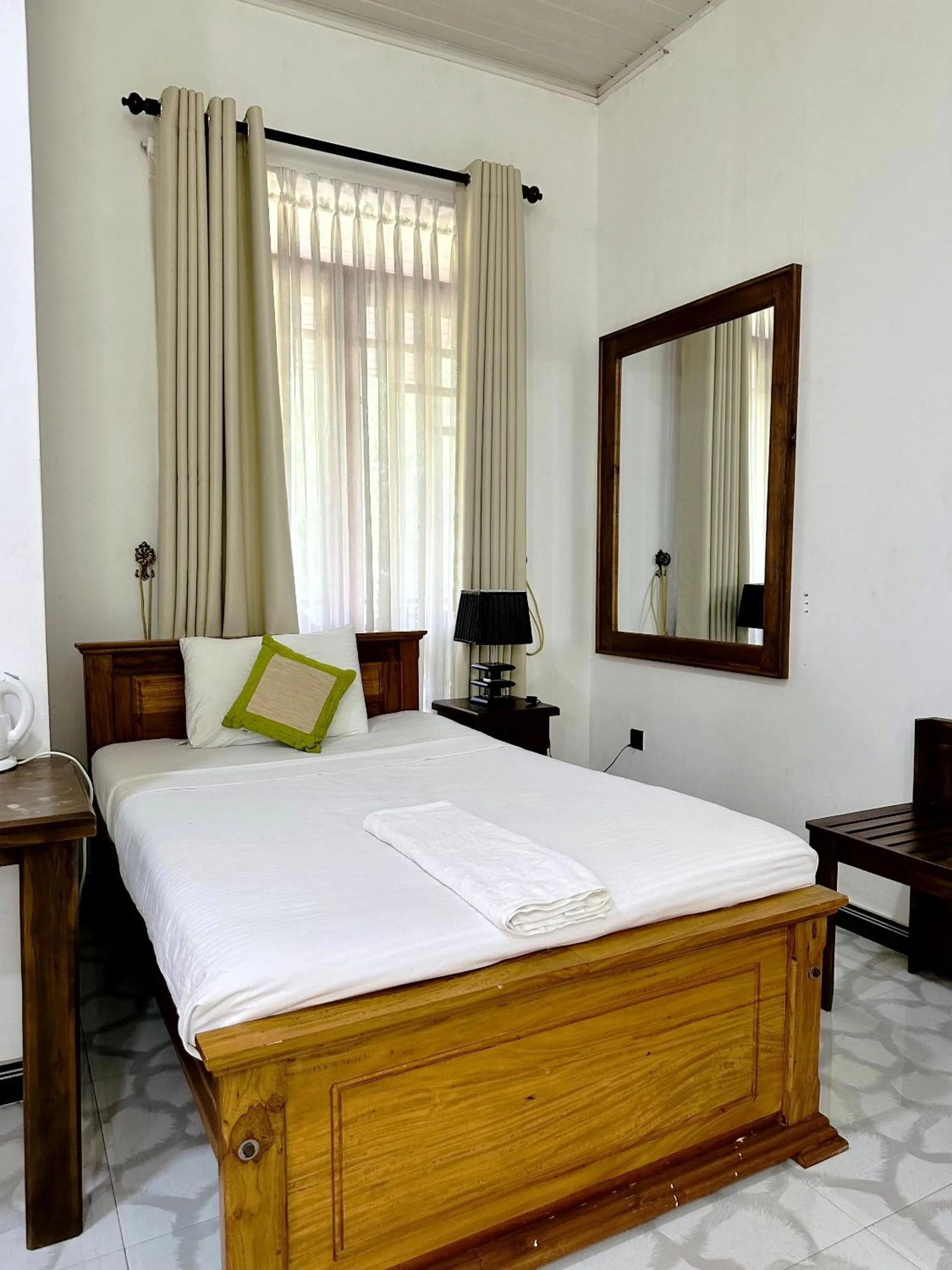 Bed in L S Lanka Hotel Dambulla