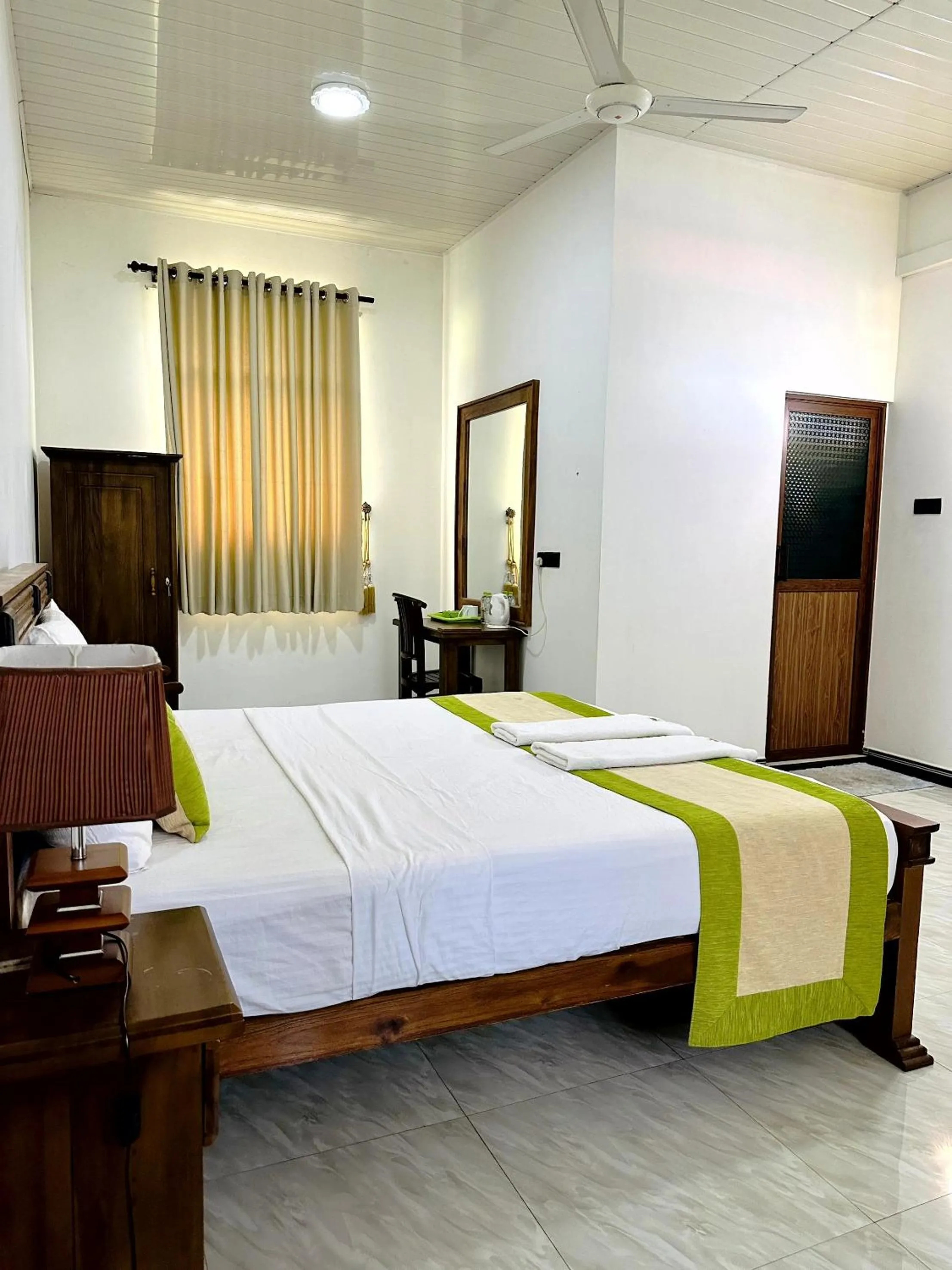 Bed in L S Lanka Hotel Dambulla