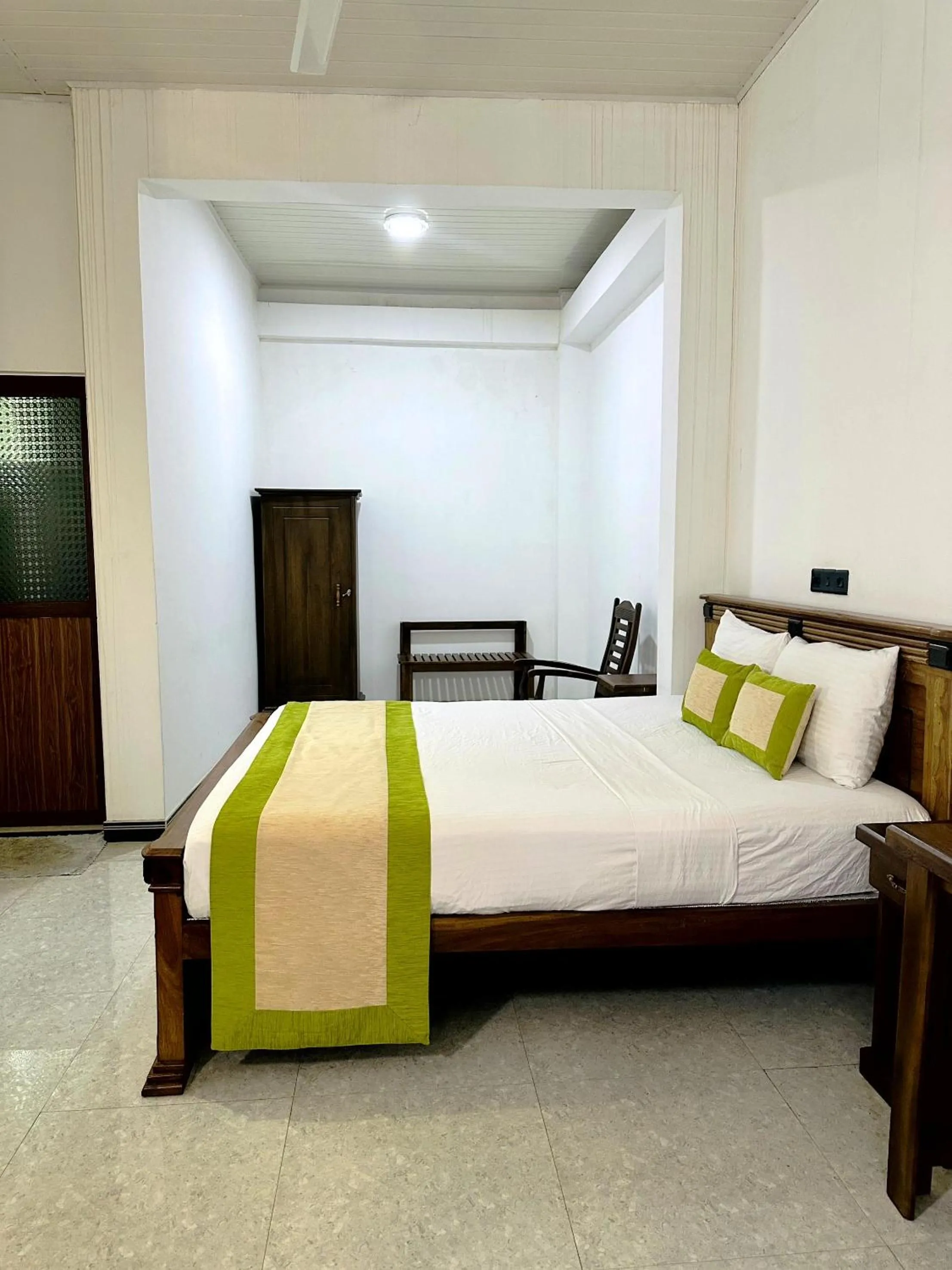 Bed in L S Lanka Hotel Dambulla