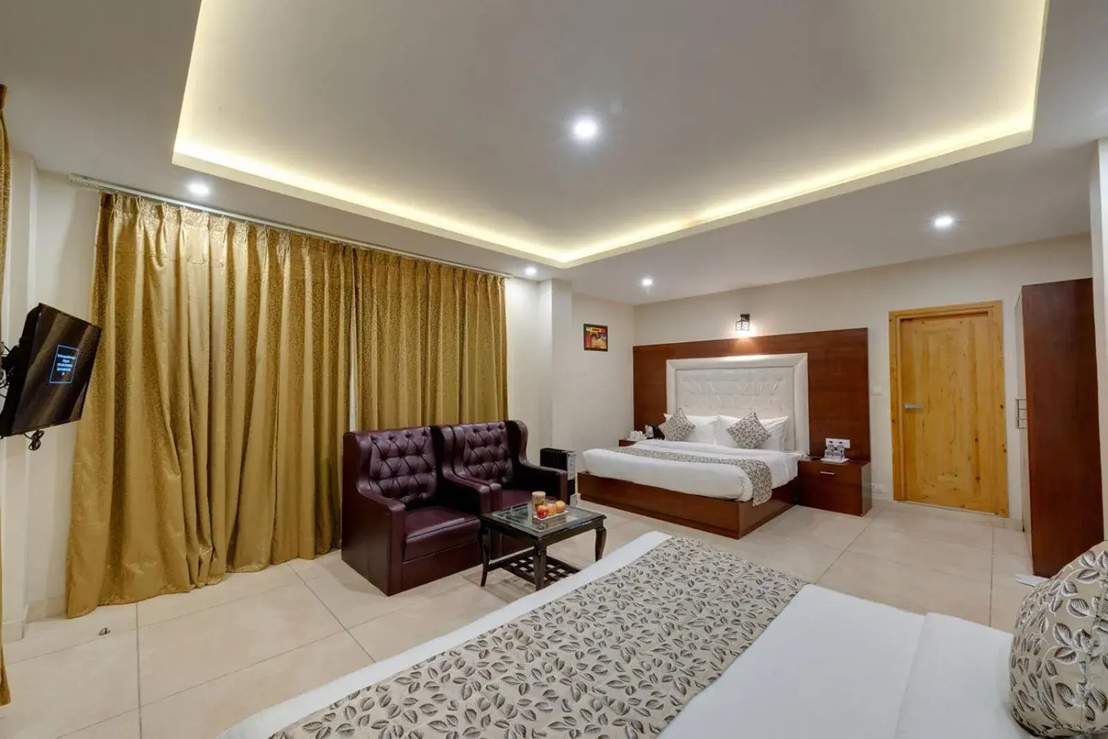 TV and multimedia, Bed in Regenta Place Green Leaf Manali- A Centrally Heated Resort TV and multimedia, Bed in Regenta Place Green Leaf Manali- A Centrally Heated Resort