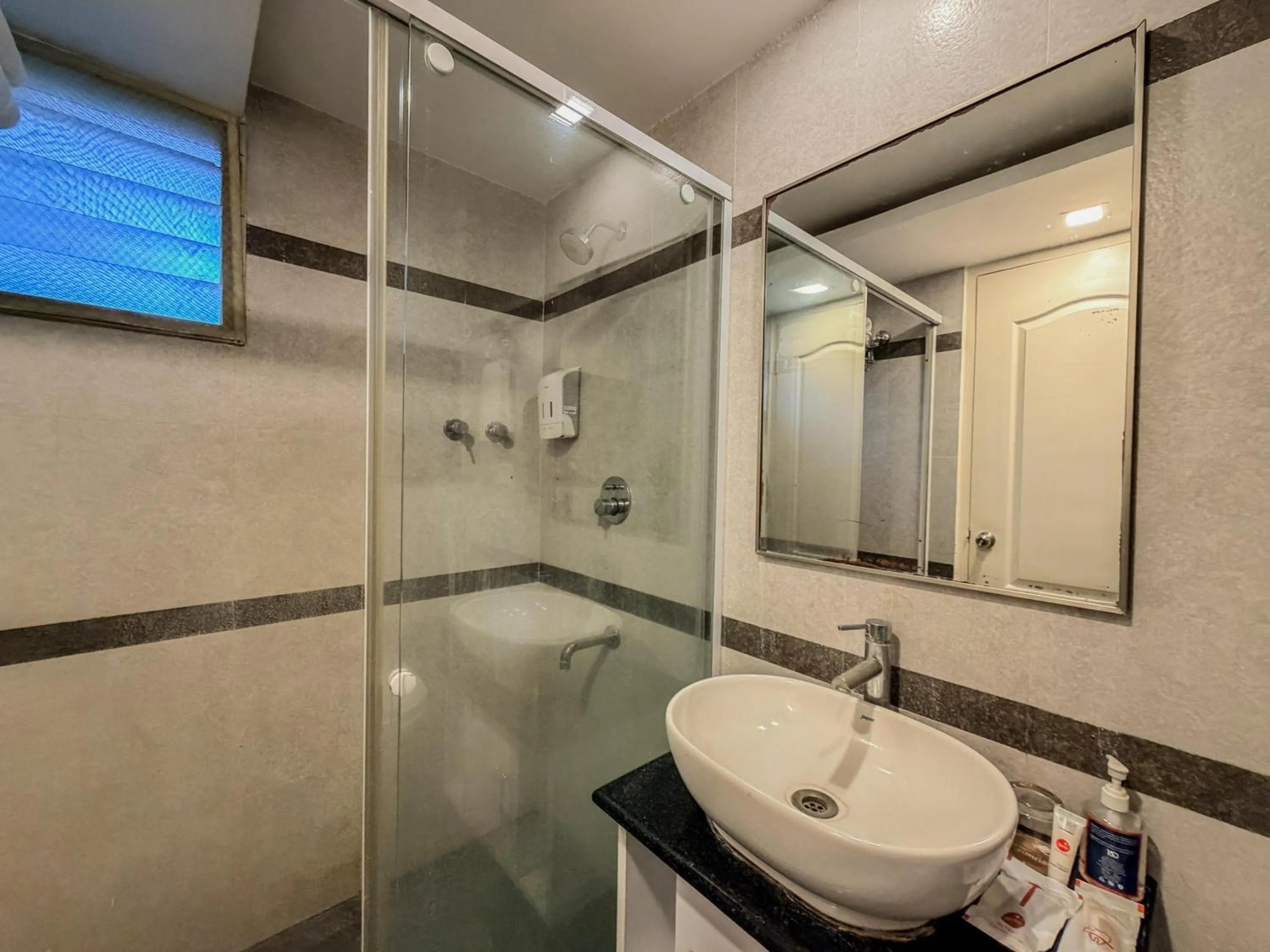 Shower in Zip By Spree Hotels Surabi International Vellore