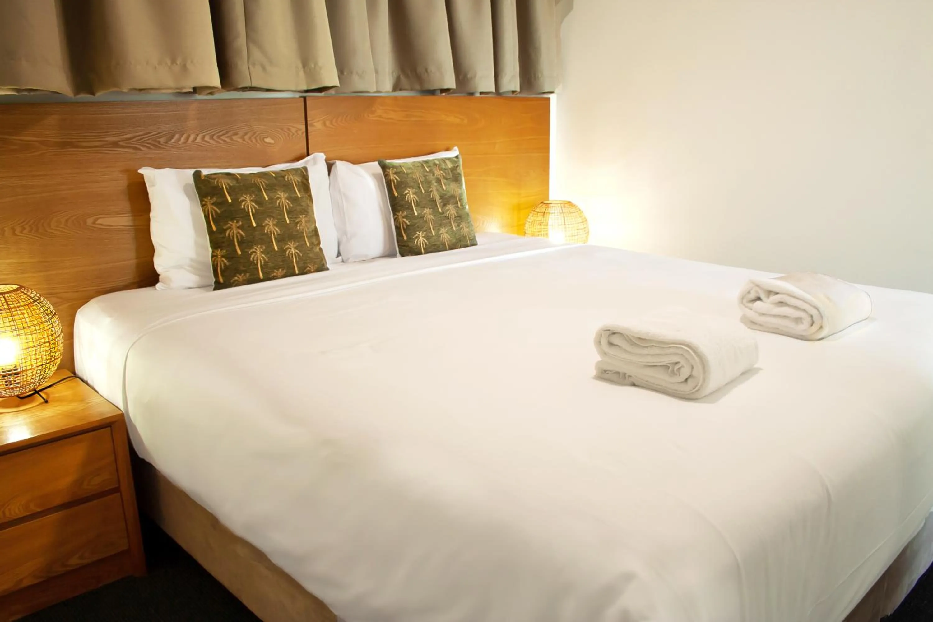 Bed in Oshen Holiday Apartments Yeppoon