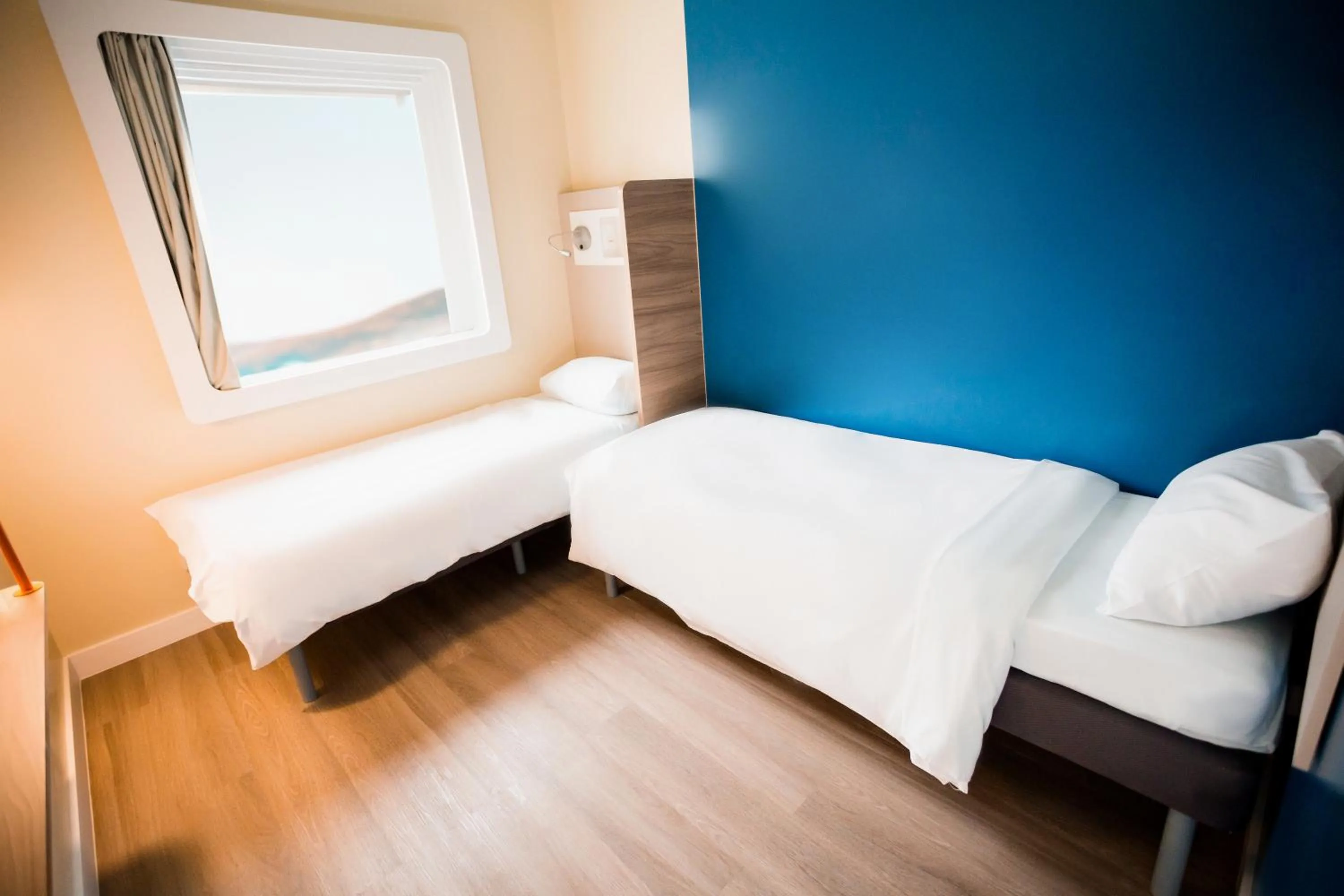 View (from property/room), Bed in IBIS BUDGET CAPAO Bonito