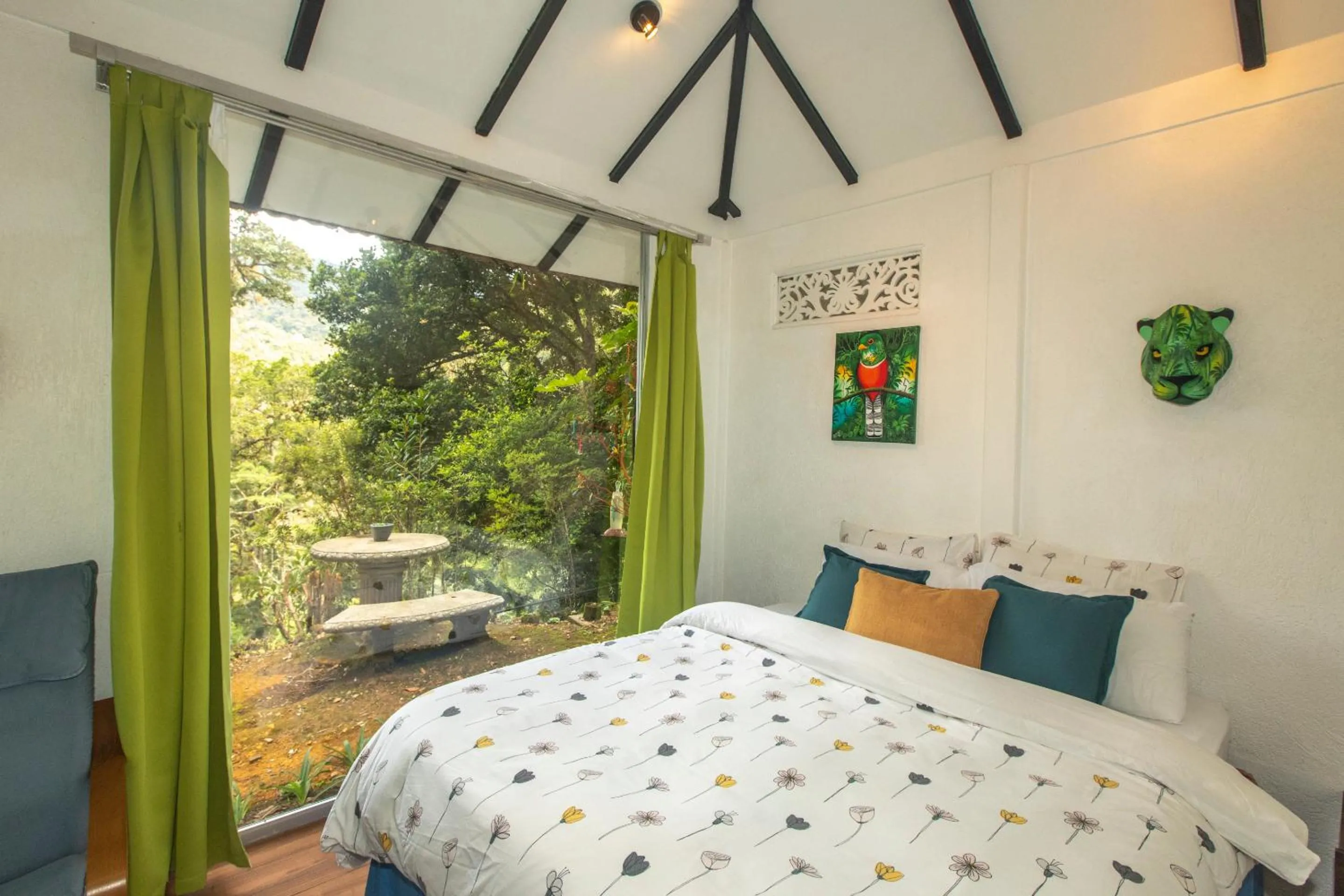 Bed in Dantica Cloud Forest Lodge