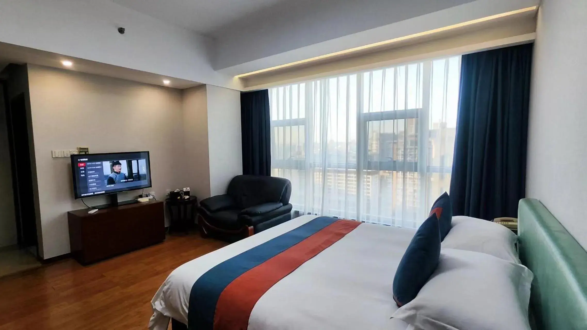 Communal lounge/ TV room, Bed in East King Business Hotel (West Lake store, Hangzhou) Communal lounge/ TV room, Bed in East King Business Hotel (West Lake store, Hangzhou)