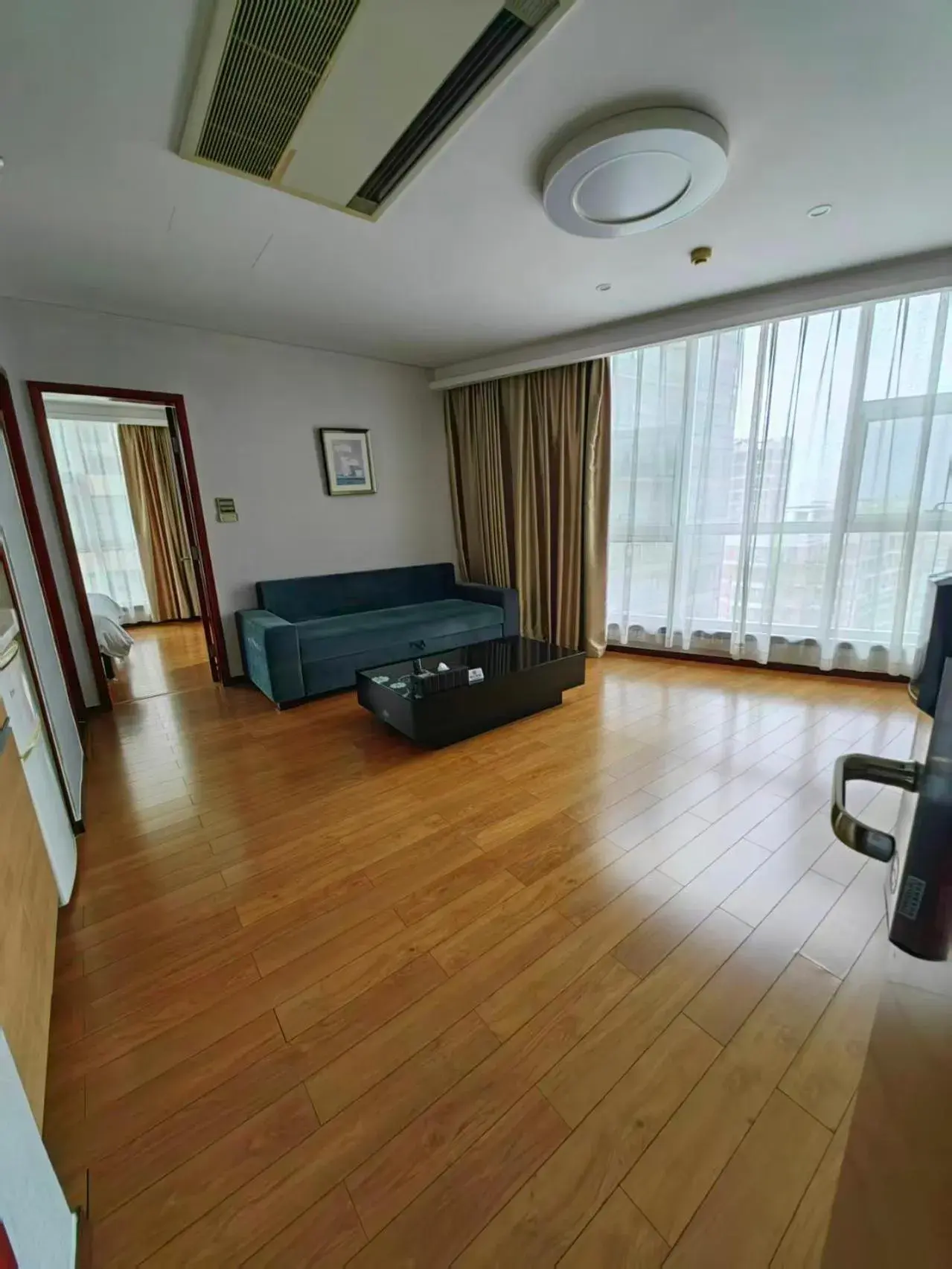 Living room in East King Business Hotel (West Lake store, Hangzhou) Living room in East King Business Hotel (West Lake store, Hangzhou)