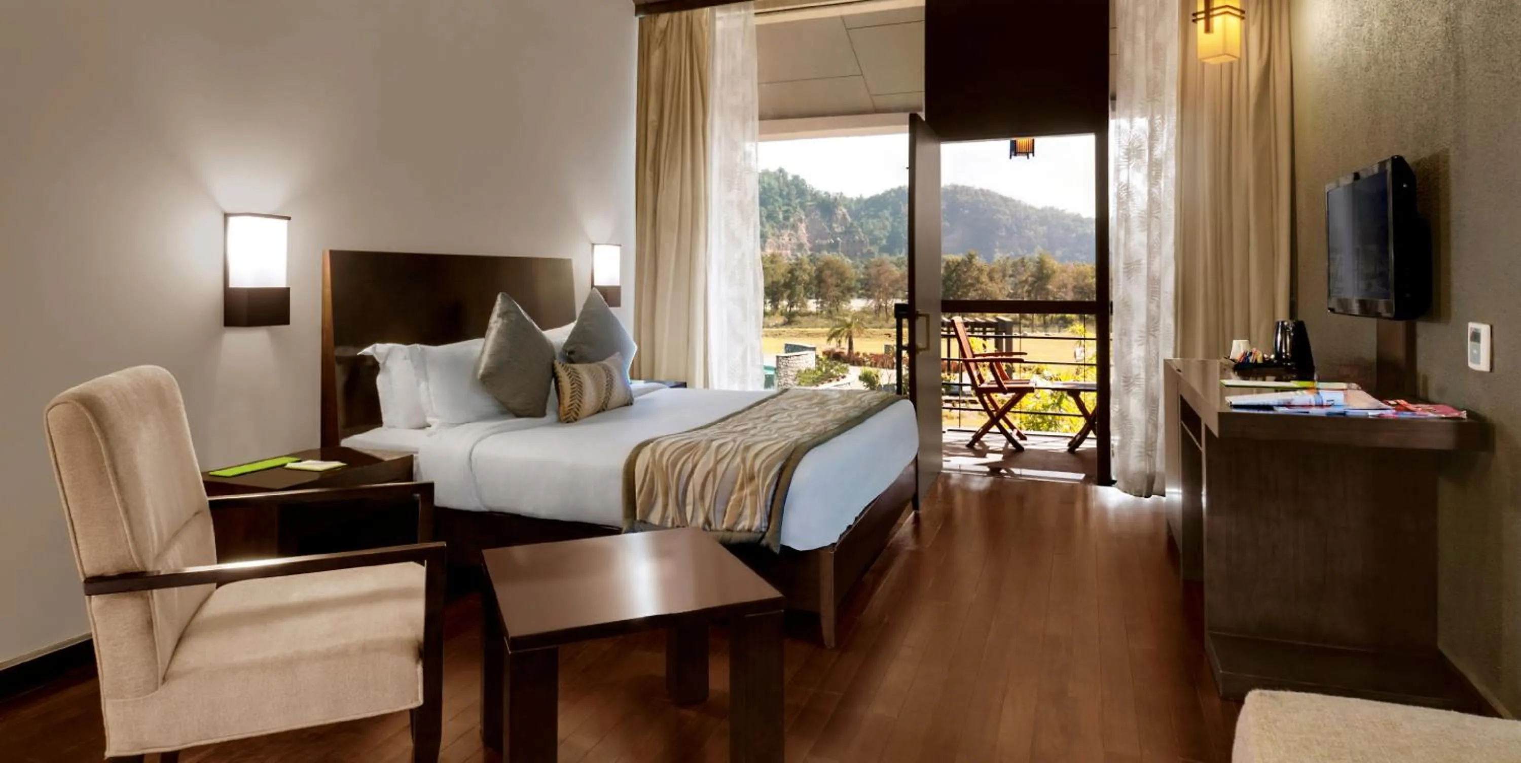 Photo of the whole room, Bed in Namah Resort Jim Corbett, a member of Radisson Individuals