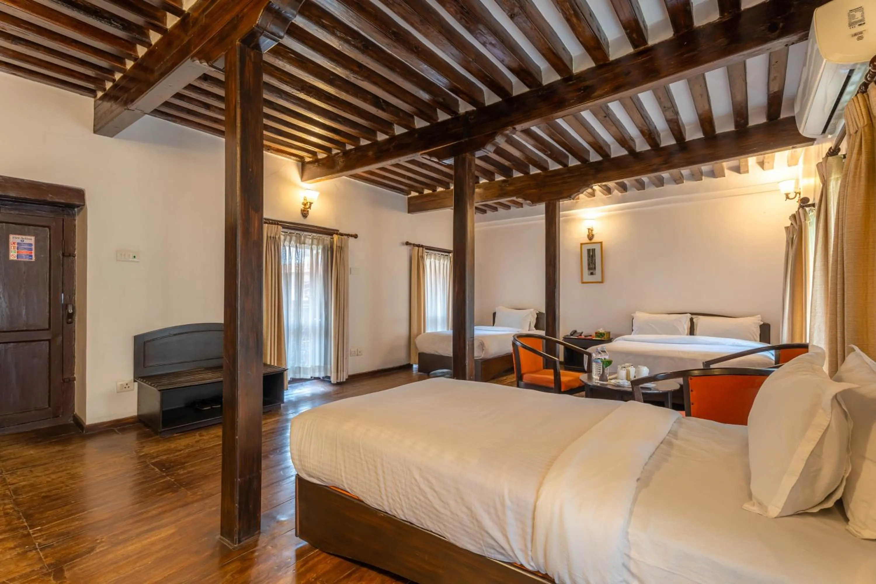 Photo of the whole room, Bed in Hukum Darbar Restaurant & Hotel