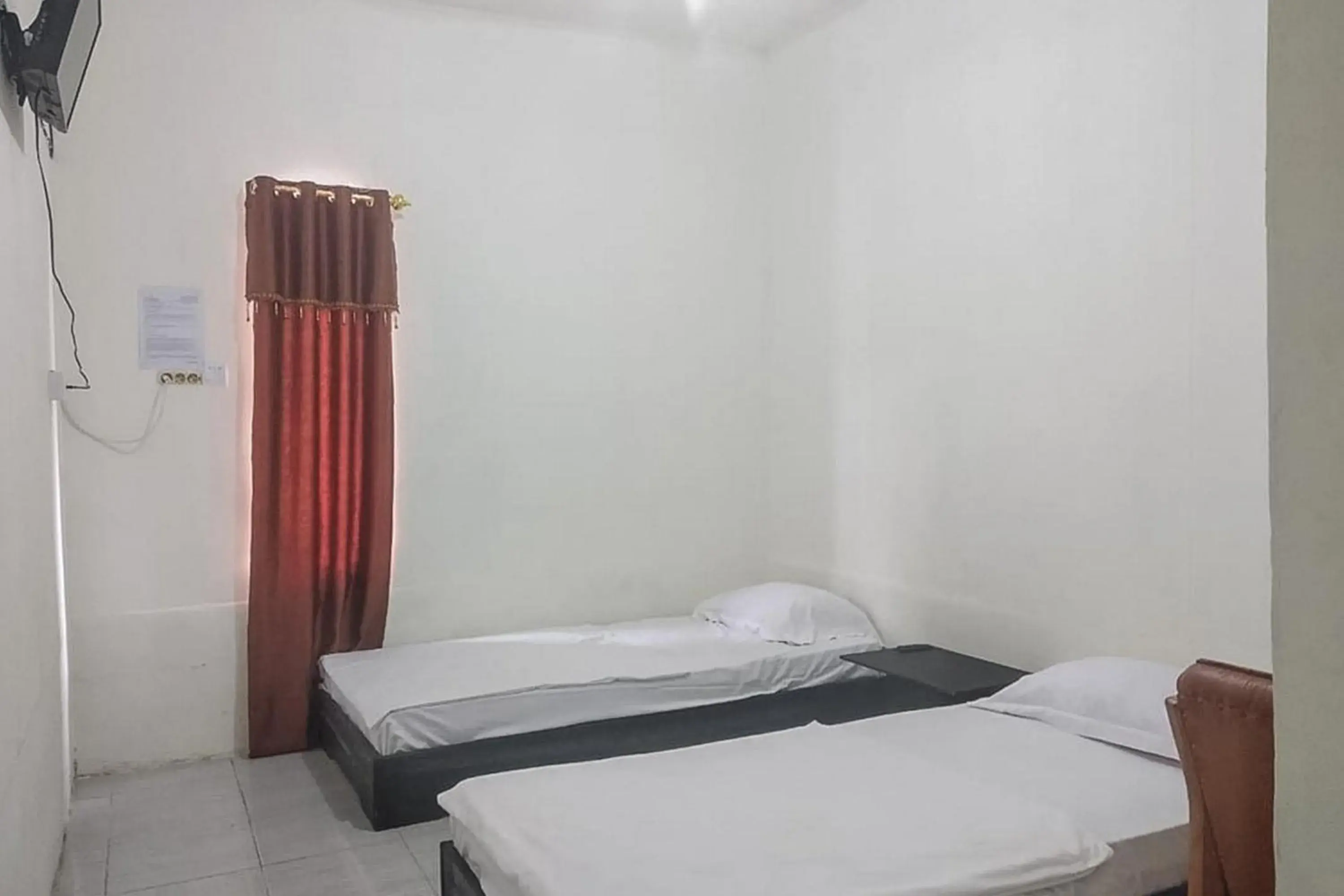Bed in Nayla Homestay Jambi Mitra RedDoorz Bed in Nayla Homestay Jambi Mitra RedDoorz