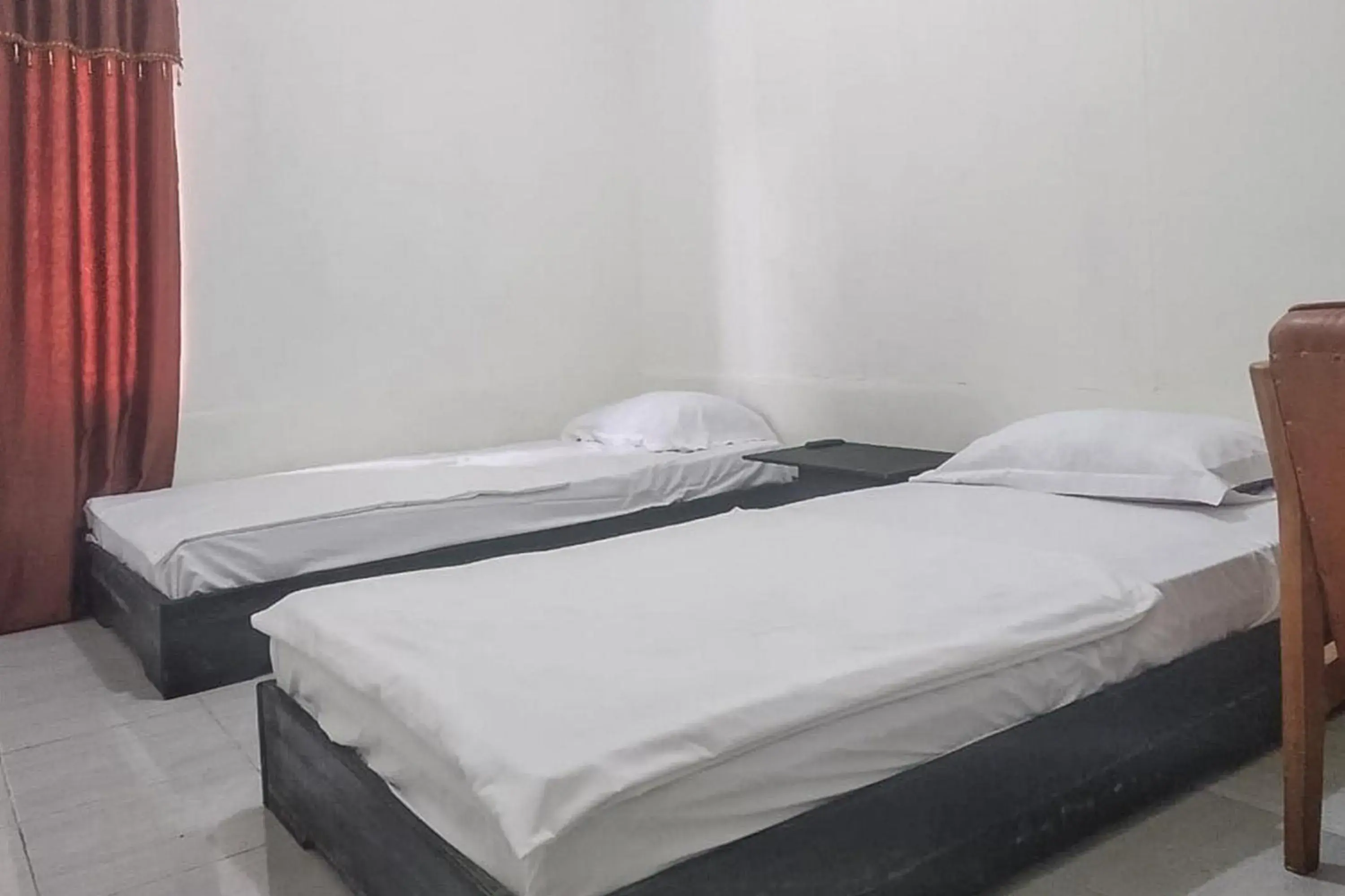 Bed in Nayla Homestay Jambi Mitra RedDoorz Bed in Nayla Homestay Jambi Mitra RedDoorz