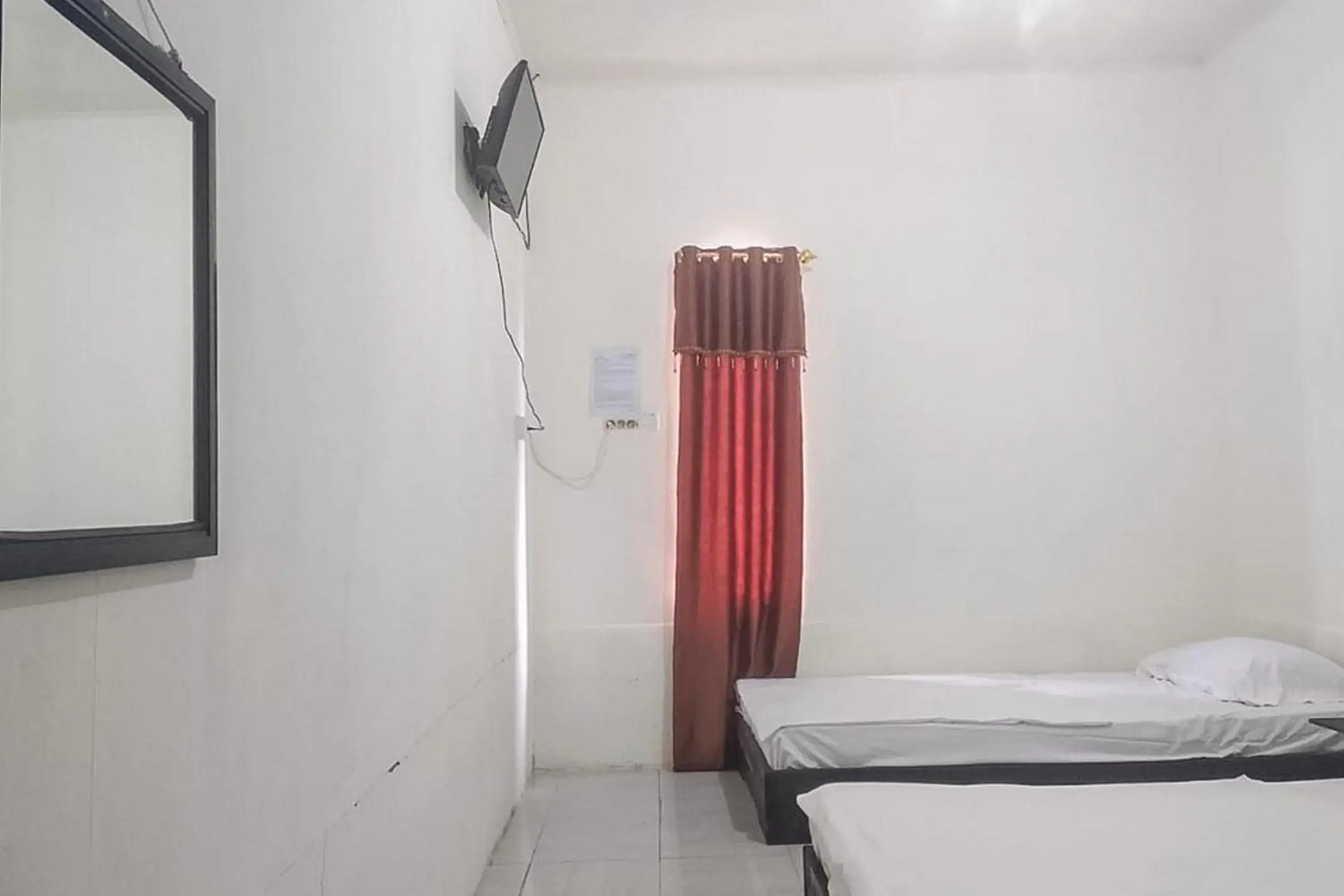 Bed in Nayla Homestay Jambi Mitra RedDoorz Bed in Nayla Homestay Jambi Mitra RedDoorz